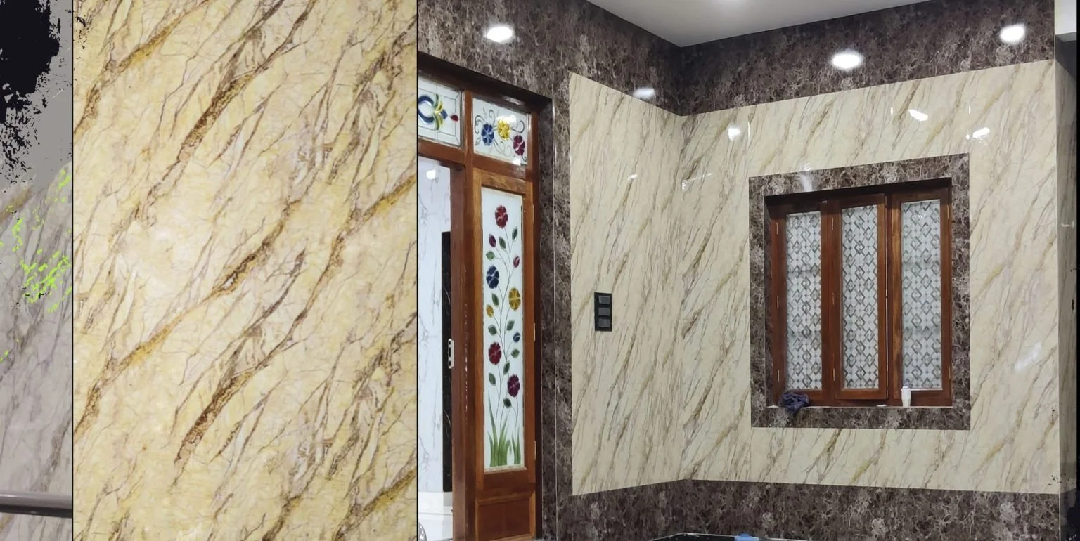 Luxury hall interior with poly granite sheet wall panelling and TV unit in Sri Ganesh Township, Ballepalli.