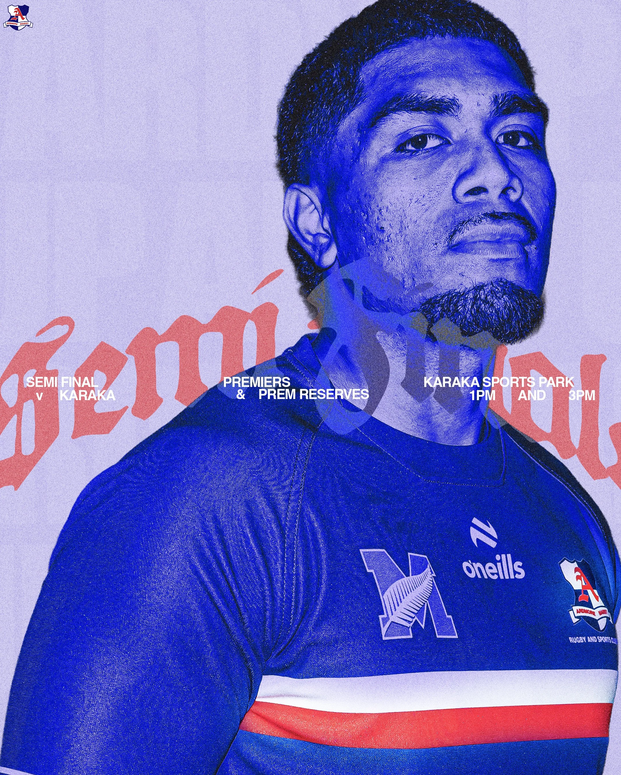 Close-up of a person in a dark blue sports jersey with the logo 'O'Neills' and a smaller logo on the chest, standing in front of a poster that reads 'Semi Final v Karaka' and 'Premiers & Prem Reserves' at Karaka Sports Park, with the time listed as 1