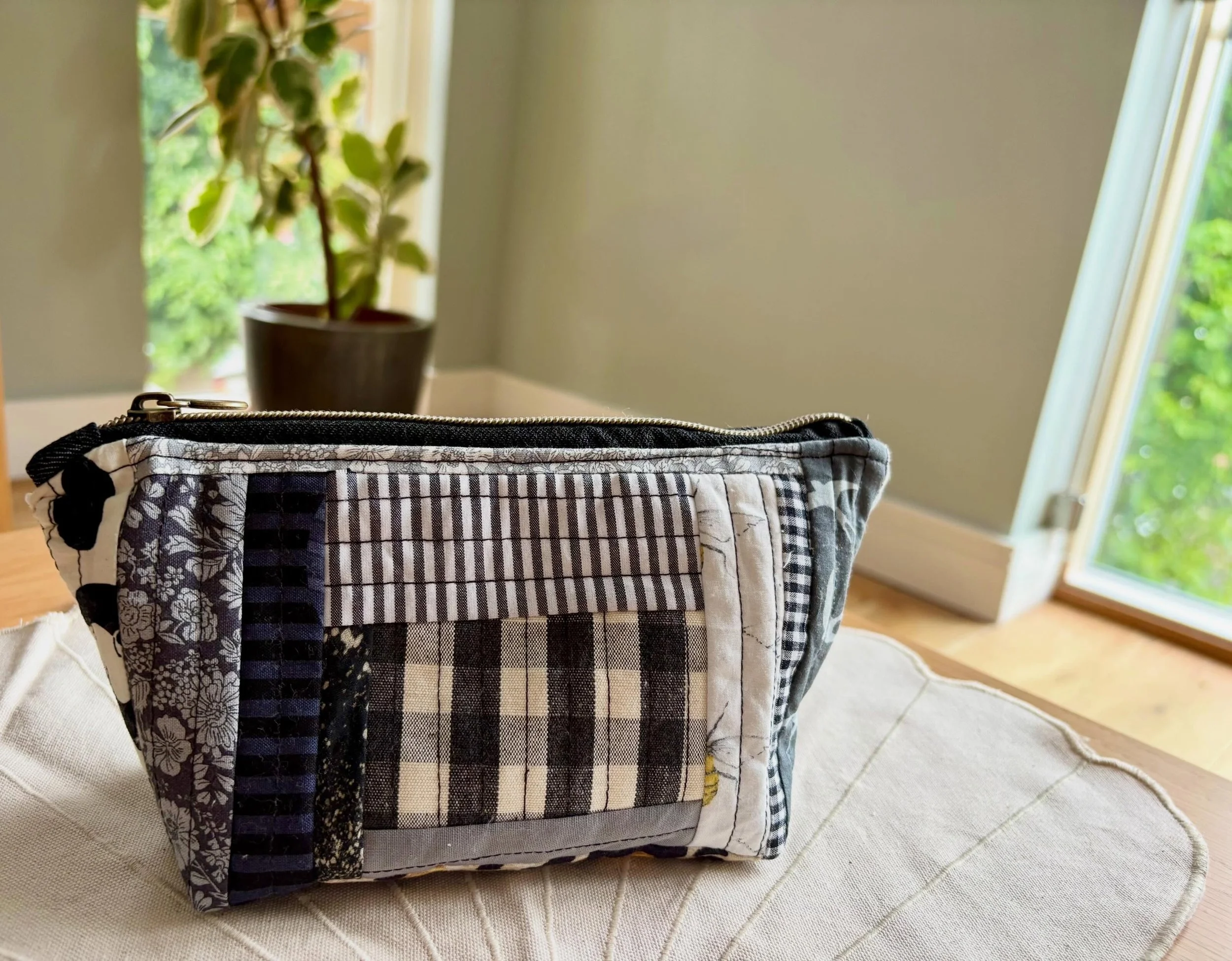 Prototype No. 1 Washbag. 

Made from a pile of fabric scraps yesterday afternoon that were too small for most projects.

Waterproof camo lining. Chunky zip. Patchwork front. Denim back.

My husband came home, saw it on the table and bought it before 
