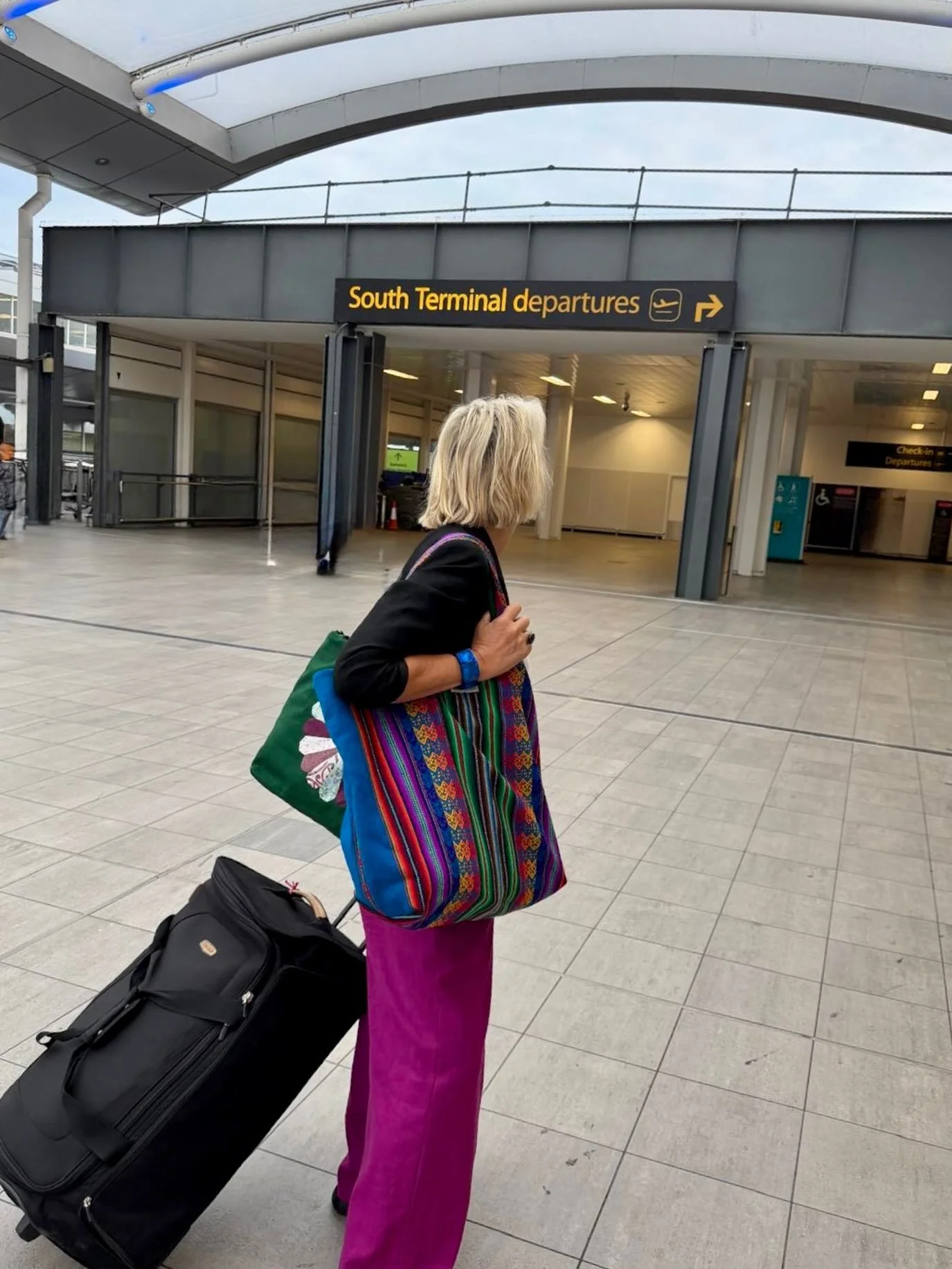 Waiting in the airport queue this morning, I had a suspicion I might be the most colourful person in it.