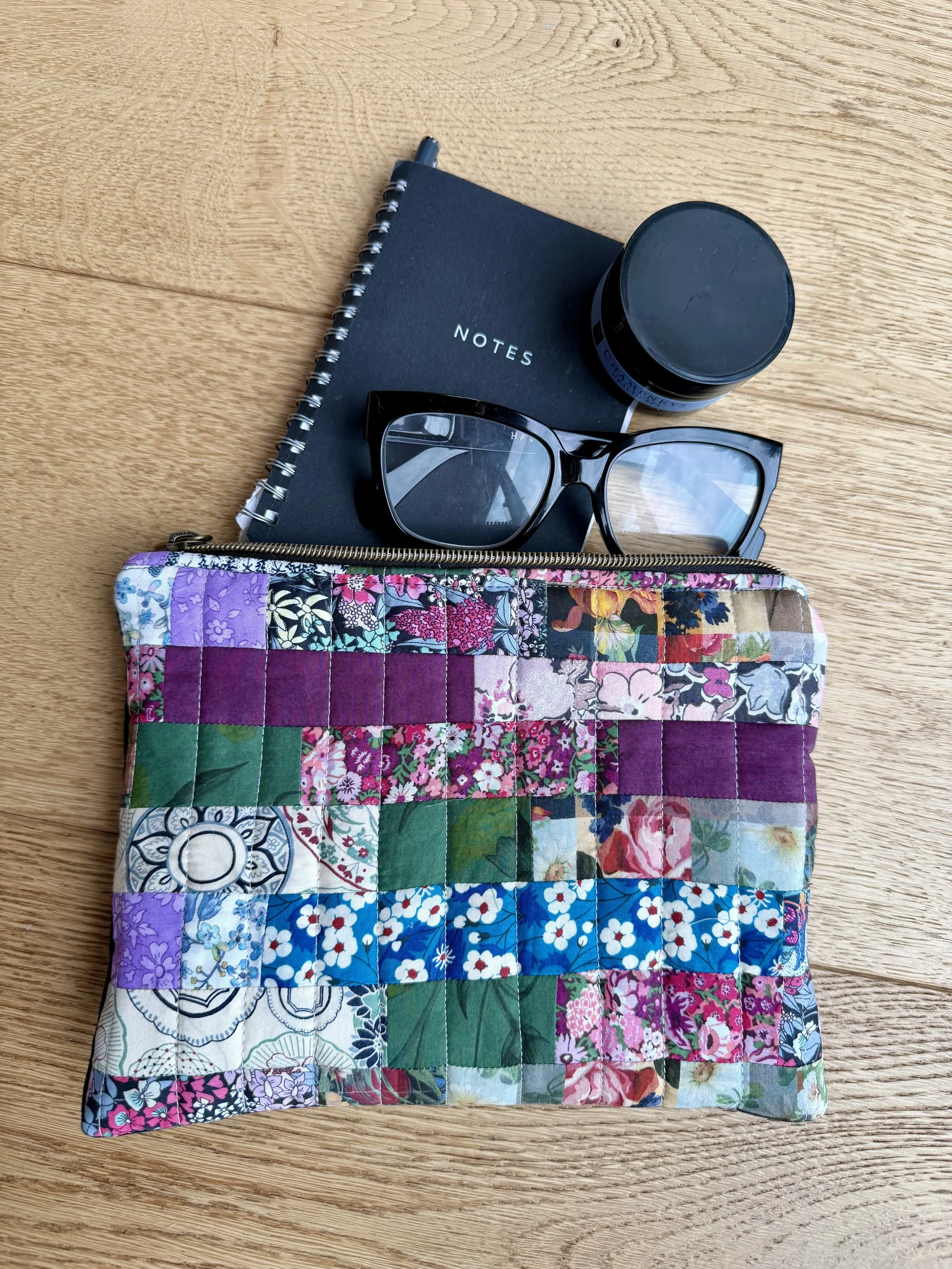 Liberty Scrapbook Pouch with notebook glasses and hand cream