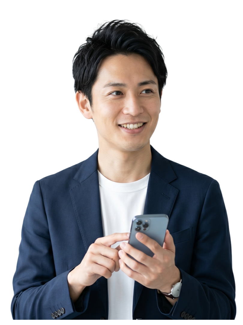 A young man with black hair wearing a dark blue blazer and a white t-shirt, smiling while looking at his smartphone.