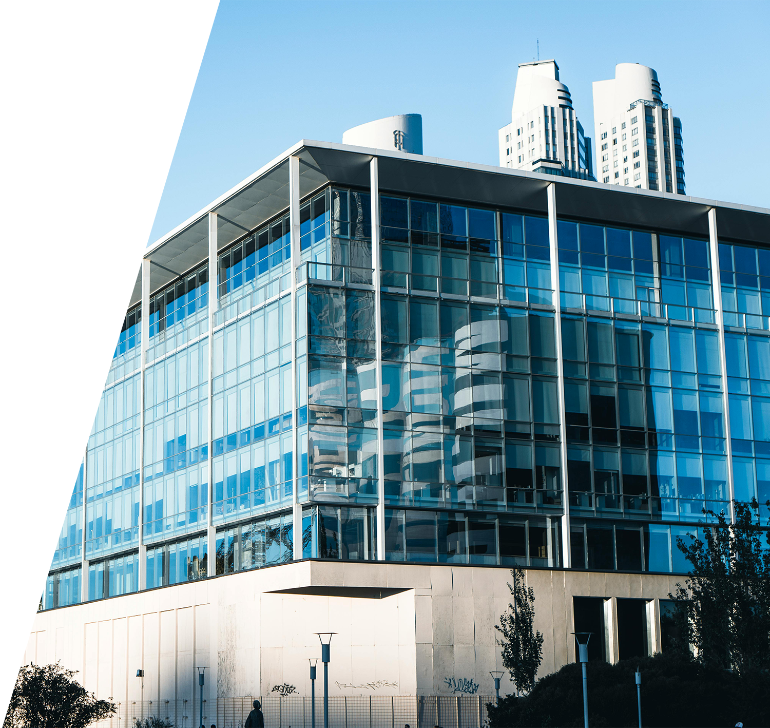 Modern glass commercial office building representing commercial insurance for business properties and corporate environments.