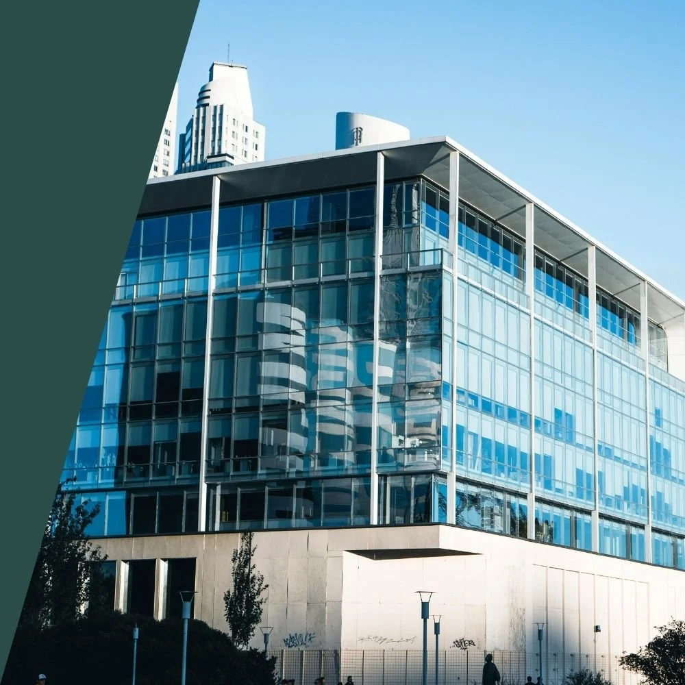 Modern glass commercial office building representing commercial insurance for business properties and corporate environments.