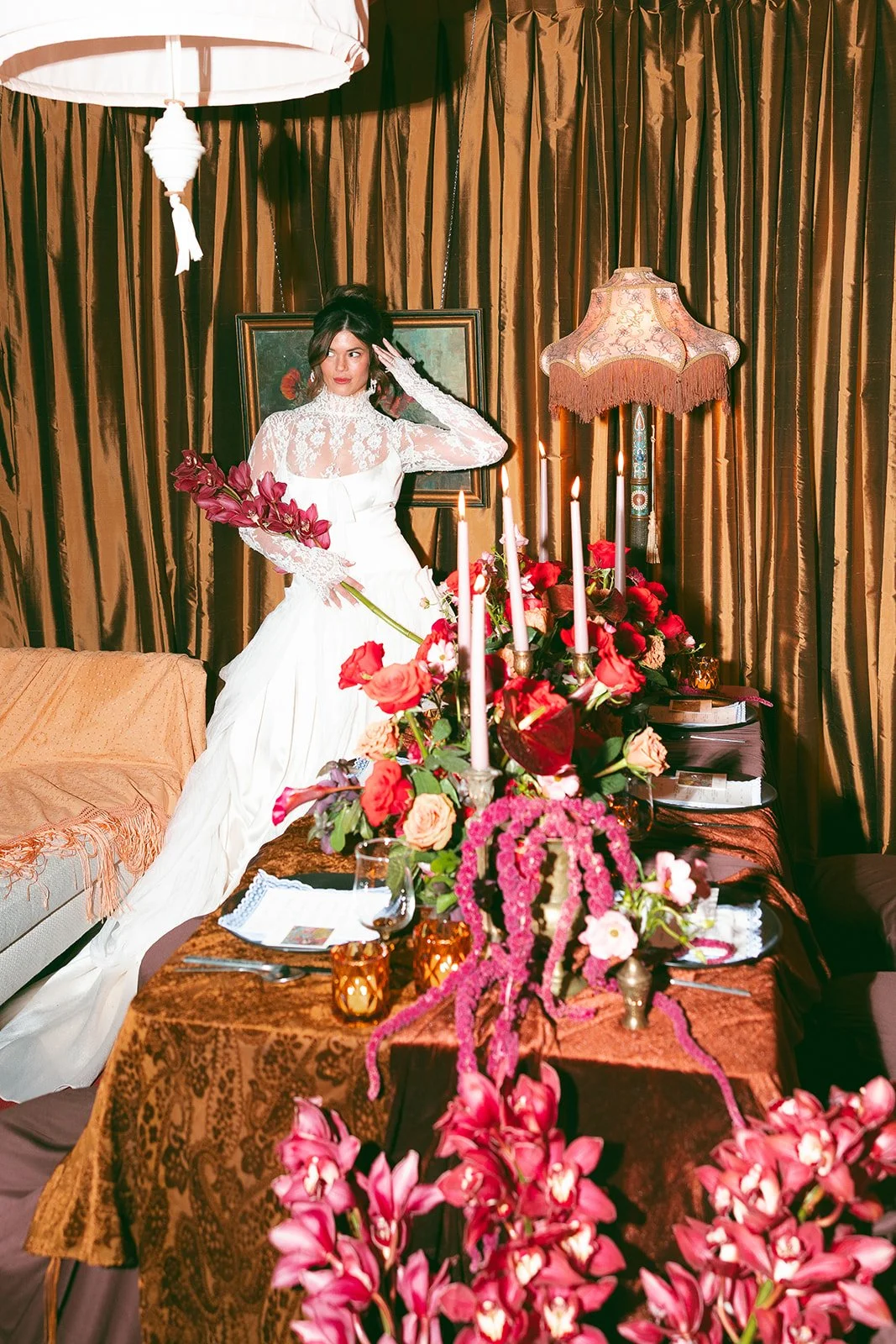 vintage maximalist editorial in le lounge no vacancy kansas city crossroads the cottage rose full service wedding florist winter wedding inspiration orchids amaranth calla lilies roses brown velvet linens vintage lamp tapestry orchid bridal bouquet
