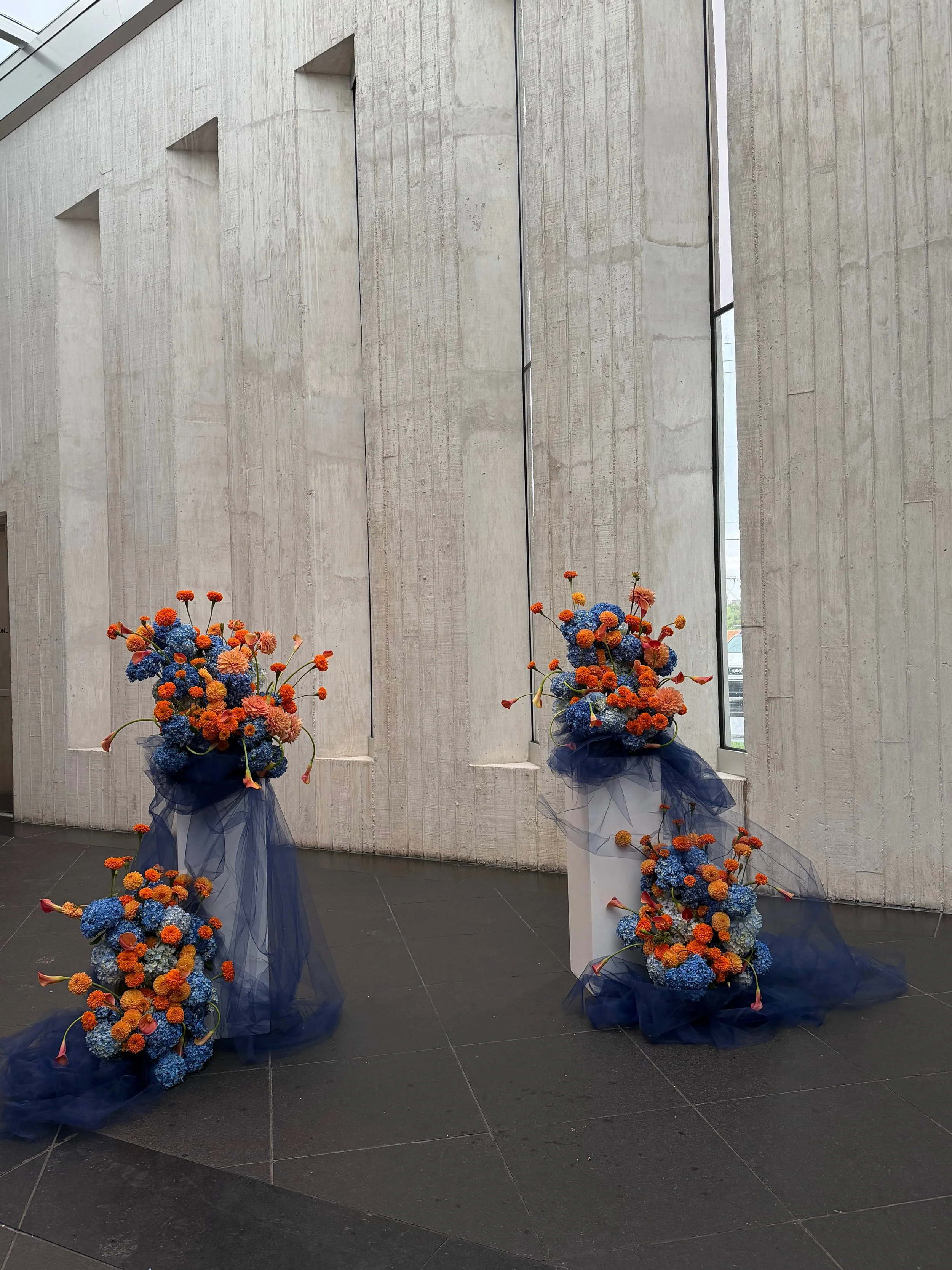 More of this orange and blue floral sculpture because I&rsquo;ll stop posting Chloe and Andy&rsquo;s wedding when I want to! #thecottagerose 
.
.
Kansas City wedding florist | destination wedding florist | full service wedding florist | event florist