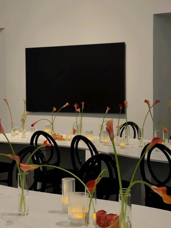 Mango calla lily sculptures for the serpentine tables 🧡

Minimal and modern to accent the space while adding color and movement #thecottagerose 
.
.
Kansas City wedding florist | destination wedding florist | full service wedding florist | event flo
