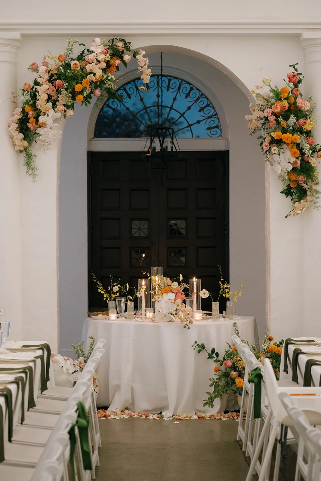 colorful fall wedding at la villa midtown kansas city the cottage rose full service wedding florist crossroads orchid ceremony hanging archway flowers marigolds modern florals sweetheart table decor
