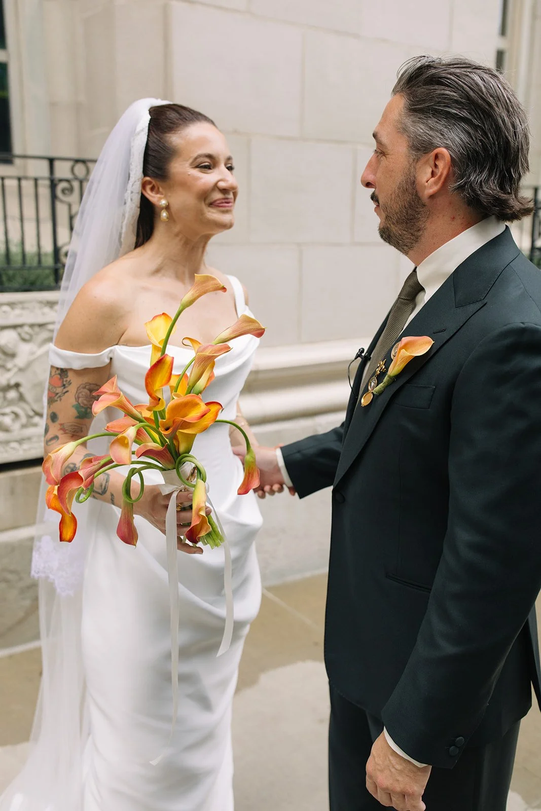 September wedding at Hotel Kansas City mango calla lilies marigolds craspedia the cottage rose full service wedding florist crossroads modern wedding flowers bridal bouquet bout and suit brooch