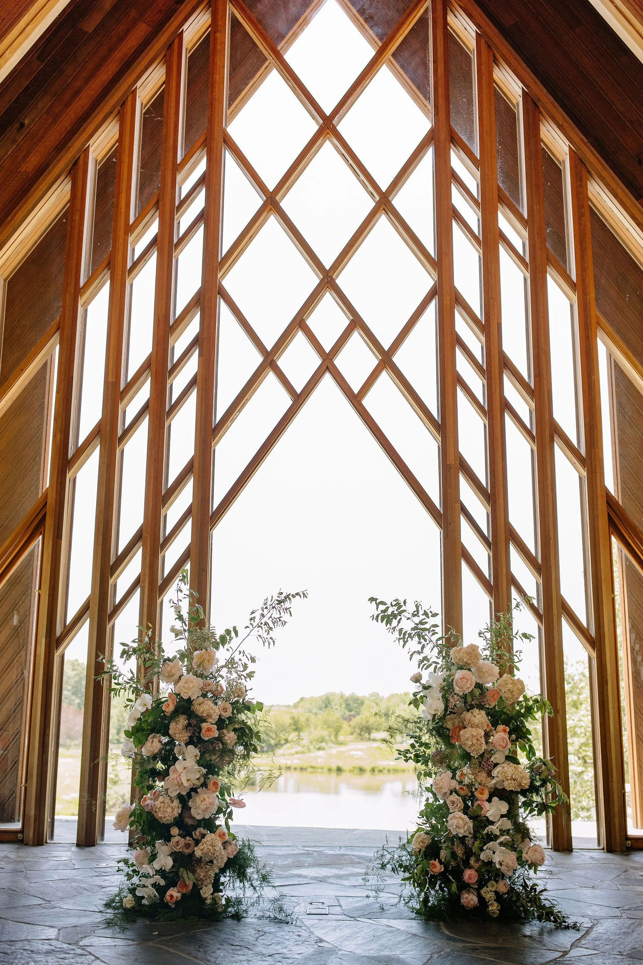 modern spring garden wedding in May ceremony at Powell Gardens reception in union crossroads kansas city floral column installation amaranth calla lilies the cottage rose wedding florist aisle decor peonies lilac altar flowers