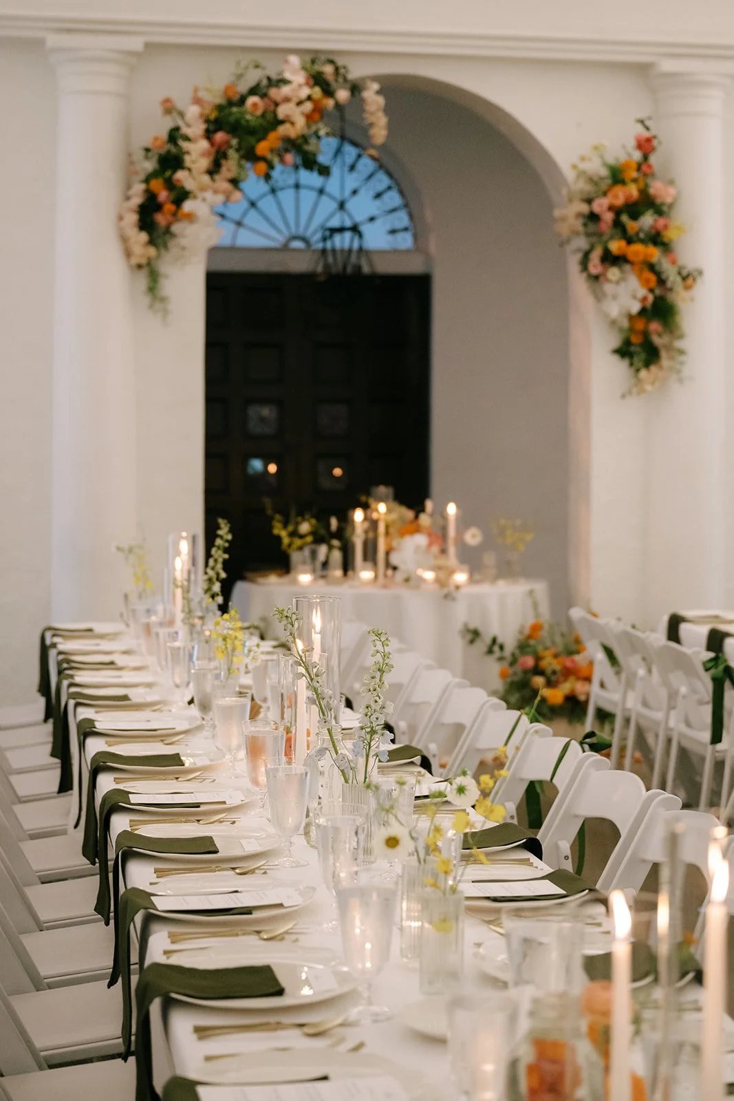 colorful fall wedding at la villa midtown kansas city the cottage rose full service wedding florist crossroads orchid ceremony hanging archway flowers marigolds modern florals sweetheart table decor bud vase centerpieces