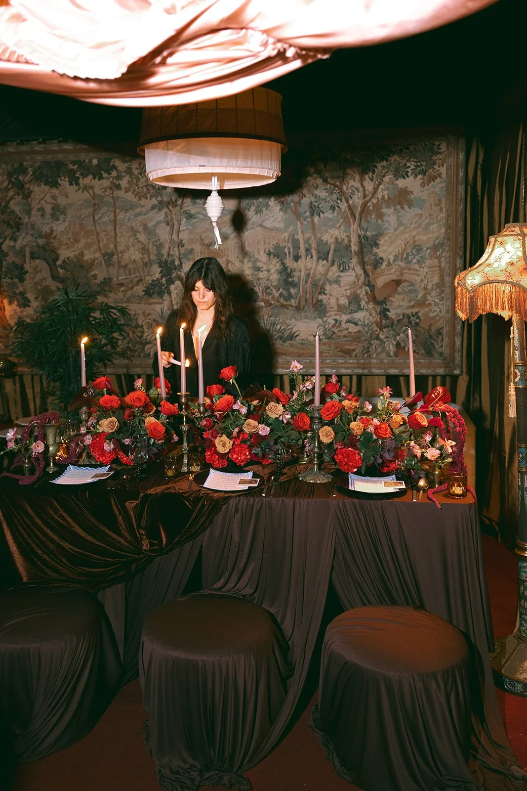 vintage maximalist editorial in le lounge no vacancy kansas city crossroads the cottage rose full service wedding florist winter wedding inspiration orchids amaranth calla lilies roses brown velvet linen vintage lamp tapestry florist lighting candles