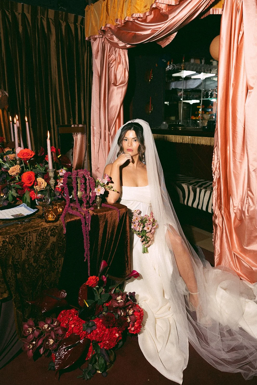 vintage maximalist editorial in le lounge no vacancy kansas city crossroads the cottage rose full service wedding florist winter wedding inspiration orchids amaranth calla lilies roses brown velvet linens vintage lamp tapestry petite bridal bouquet