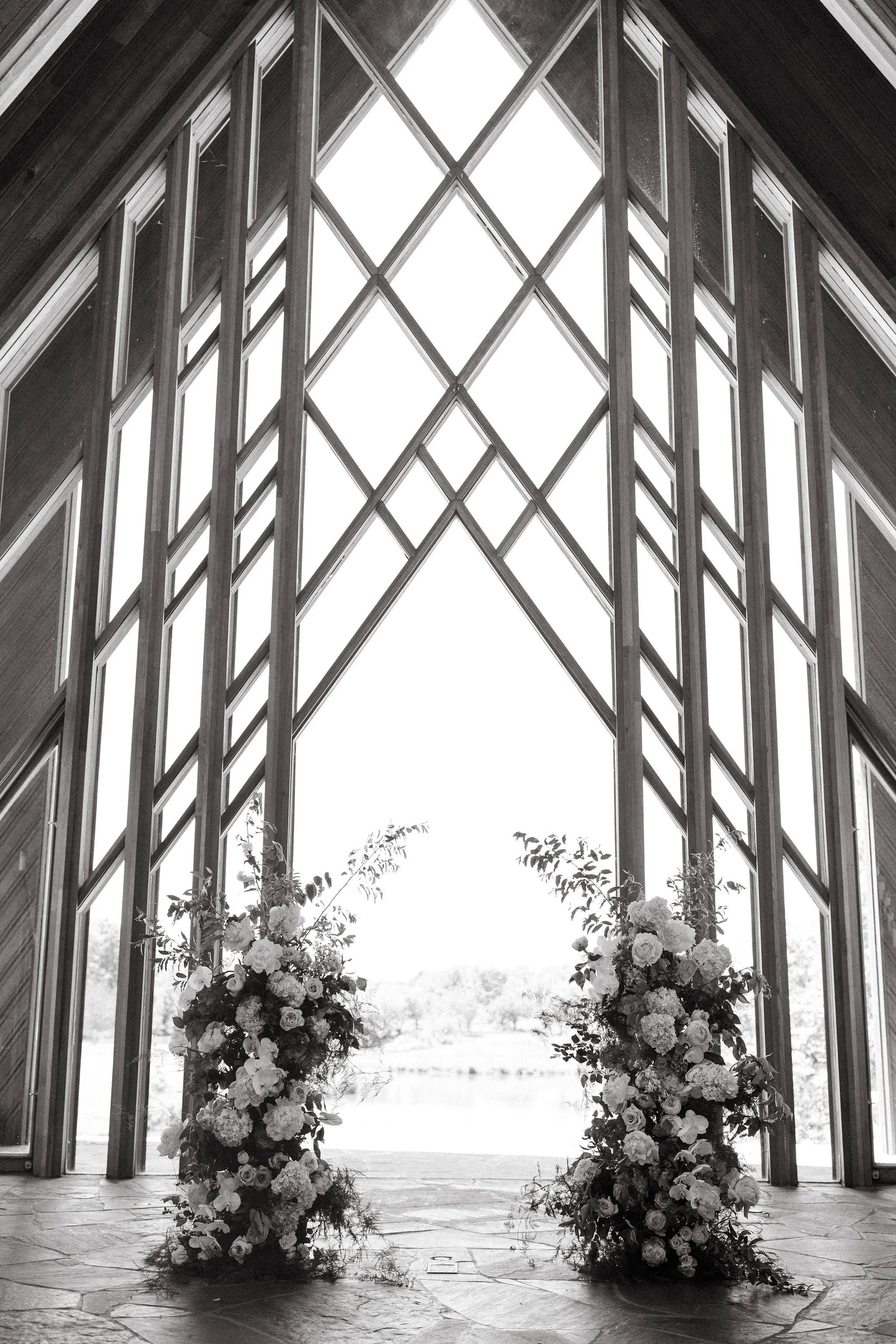 modern spring garden wedding in May ceremony at Powell Gardens reception in union crossroads kansas city floral column installation amaranth calla lilies the cottage rose wedding florist aisle decor peonies lilac altar flowers