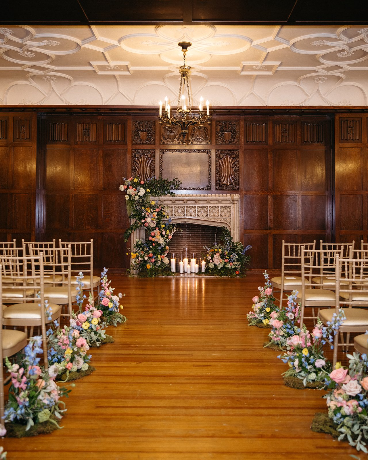what a a 20k wedding floral budget really looks like hotel kc spring wedding the cottage rose kansas city florist crossroads fireplace mantle flower installation candles aisle decor spring pastel flowers