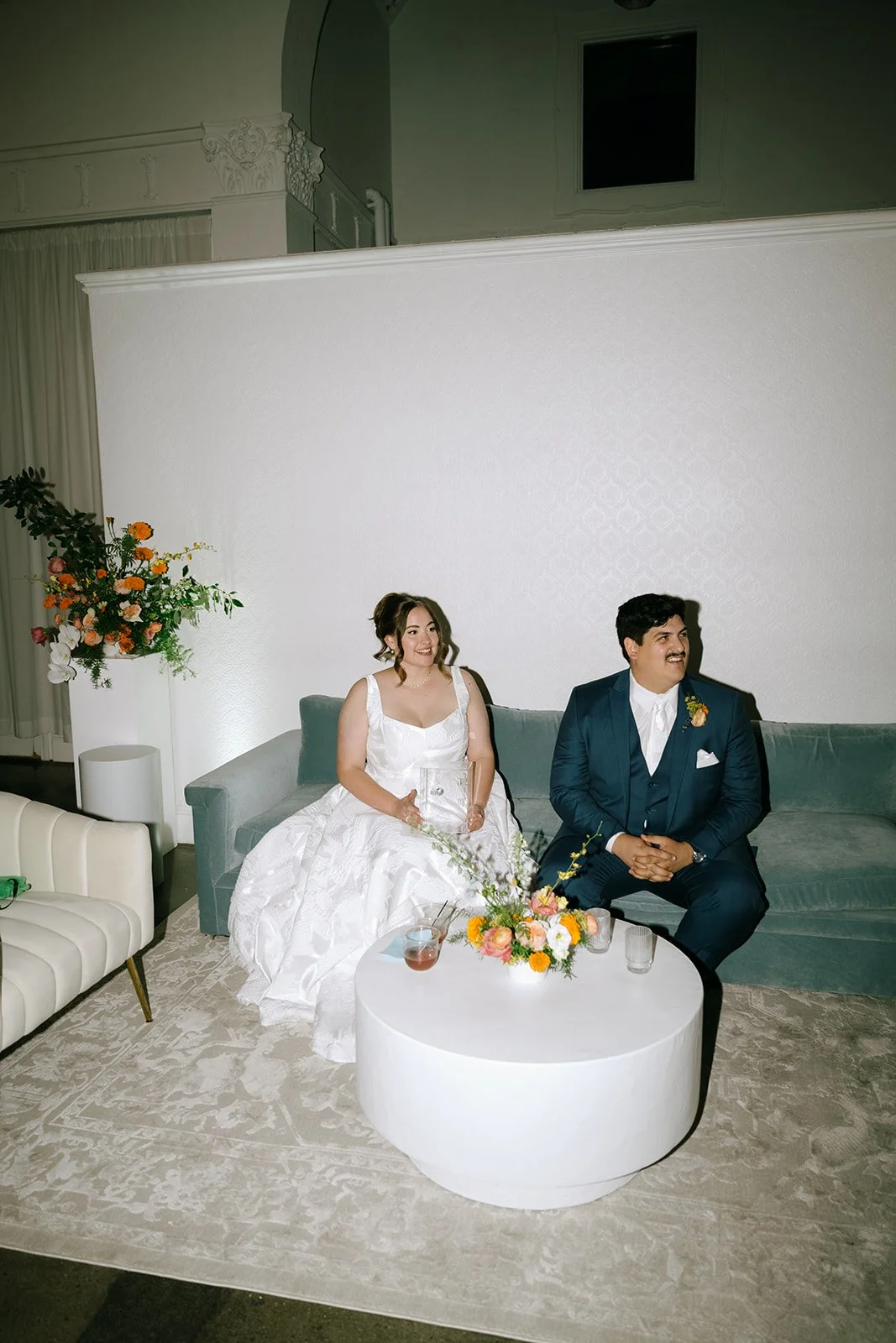 colorful fall wedding at la villa midtown kansas city the cottage rose full service wedding florist crossroads orchid ceremony hanging archway flowers marigolds modern florals lounge furniture florals