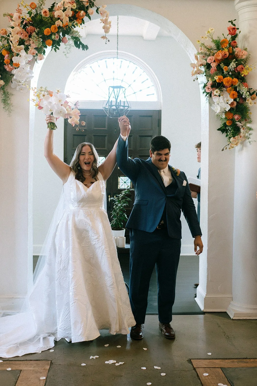 colorful fall wedding at la villa midtown kansas city the cottage rose full service wedding florist crossroads orchid ceremony hanging archway flowers marigolds modern florals