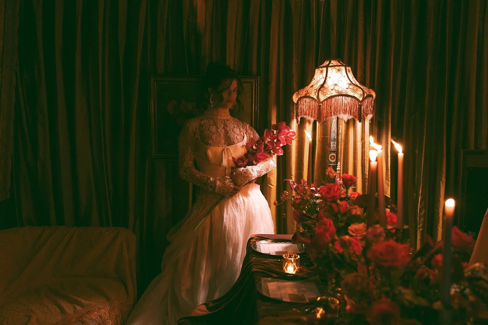 vintage maximalist editorial in le lounge no vacancy kansas city crossroads the cottage rose full service wedding florist winter wedding inspiration orchids amaranth calla lilies roses brown velvet linens vintage lamp tapestry orchid bridal bouquet