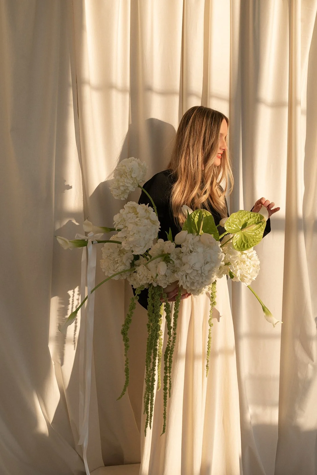 editorial branding shoot flowers maggie routon interior design studio the cottage rose full service wedding florist kansas city crossroads draped fabric ribbon calla lilies anthurium amaranth hydrangea pedestal flower arrangement