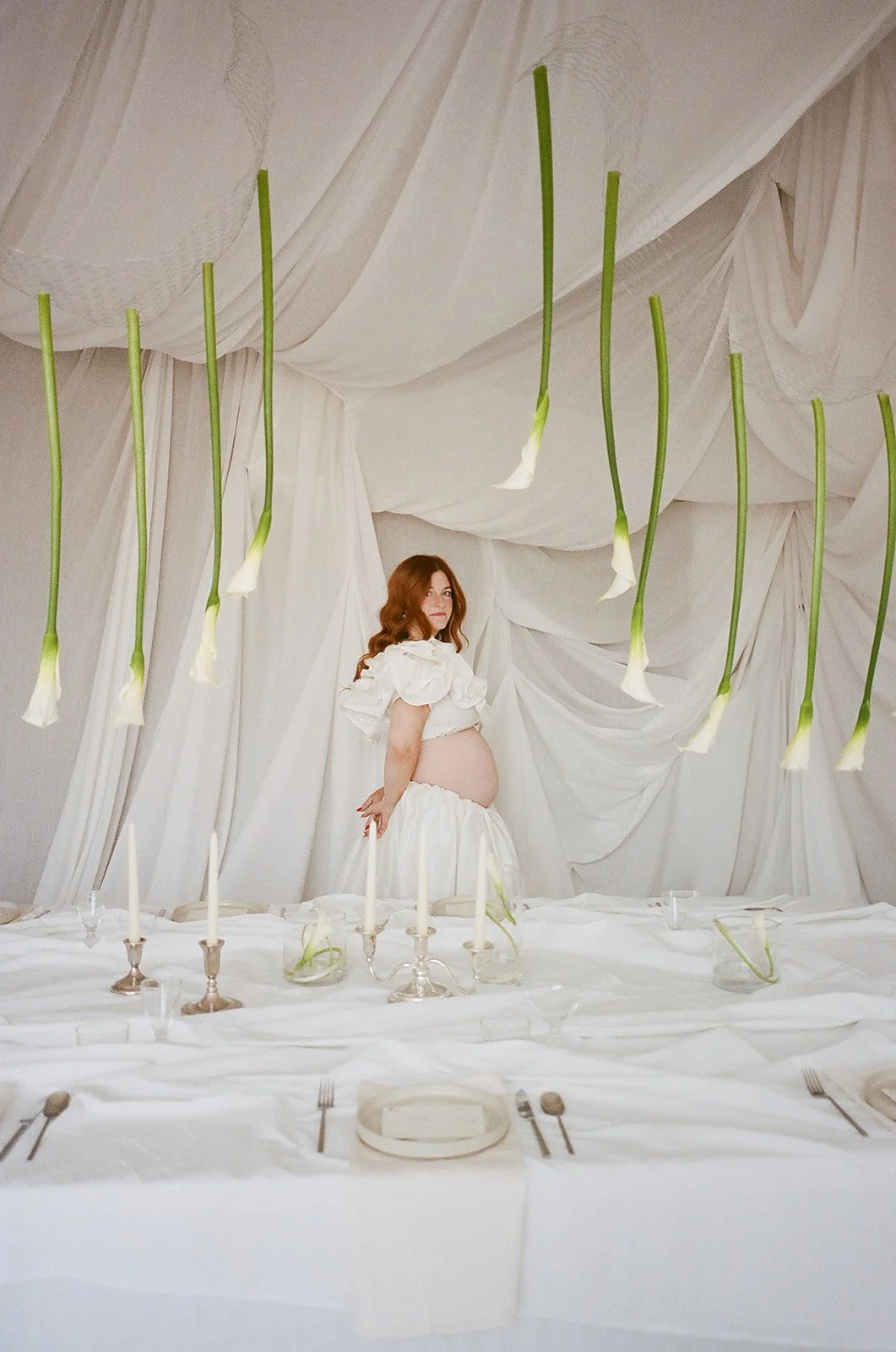 chic editorial baby shower with draped fabric hanging calla lilies minimal architectural centerpieces silver candlesticks the cottage rose full service wedding florist kansas city crossroads modern floral design