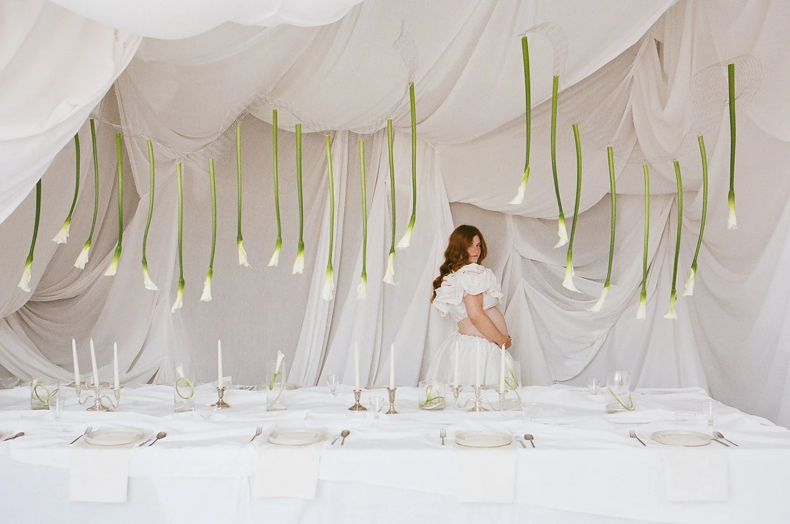 chic editorial baby shower with draped fabric hanging calla lilies minimal architectural centerpieces silver candlesticks the cottage rose full service wedding florist kansas city crossroads modern floral design