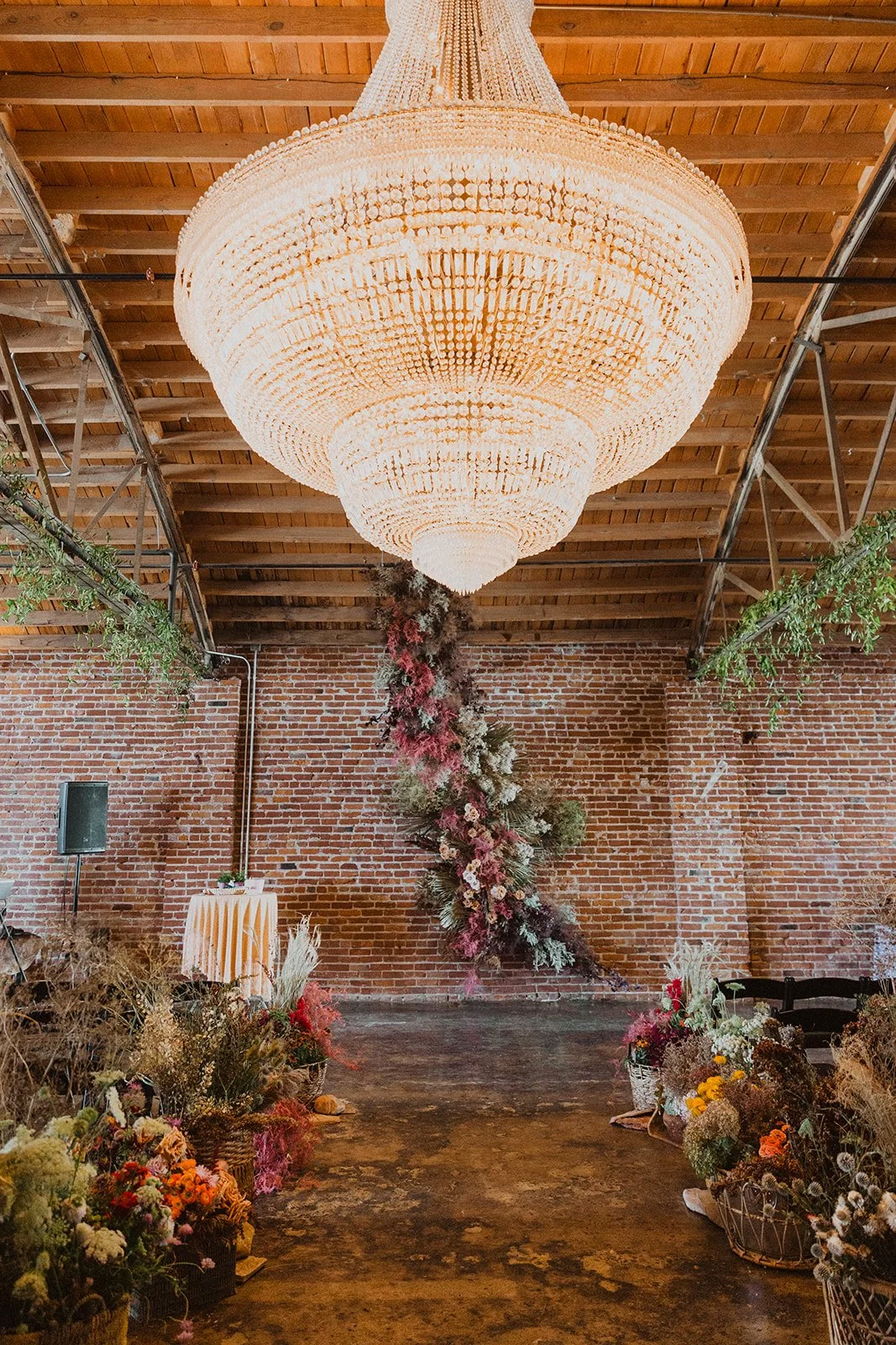 what a a 20k wedding floral budget really looks like the guild spring wedding the cottage rose kansas city florist crossroads dried floral installation hanging florals baskets colorful summer wedding ceremony