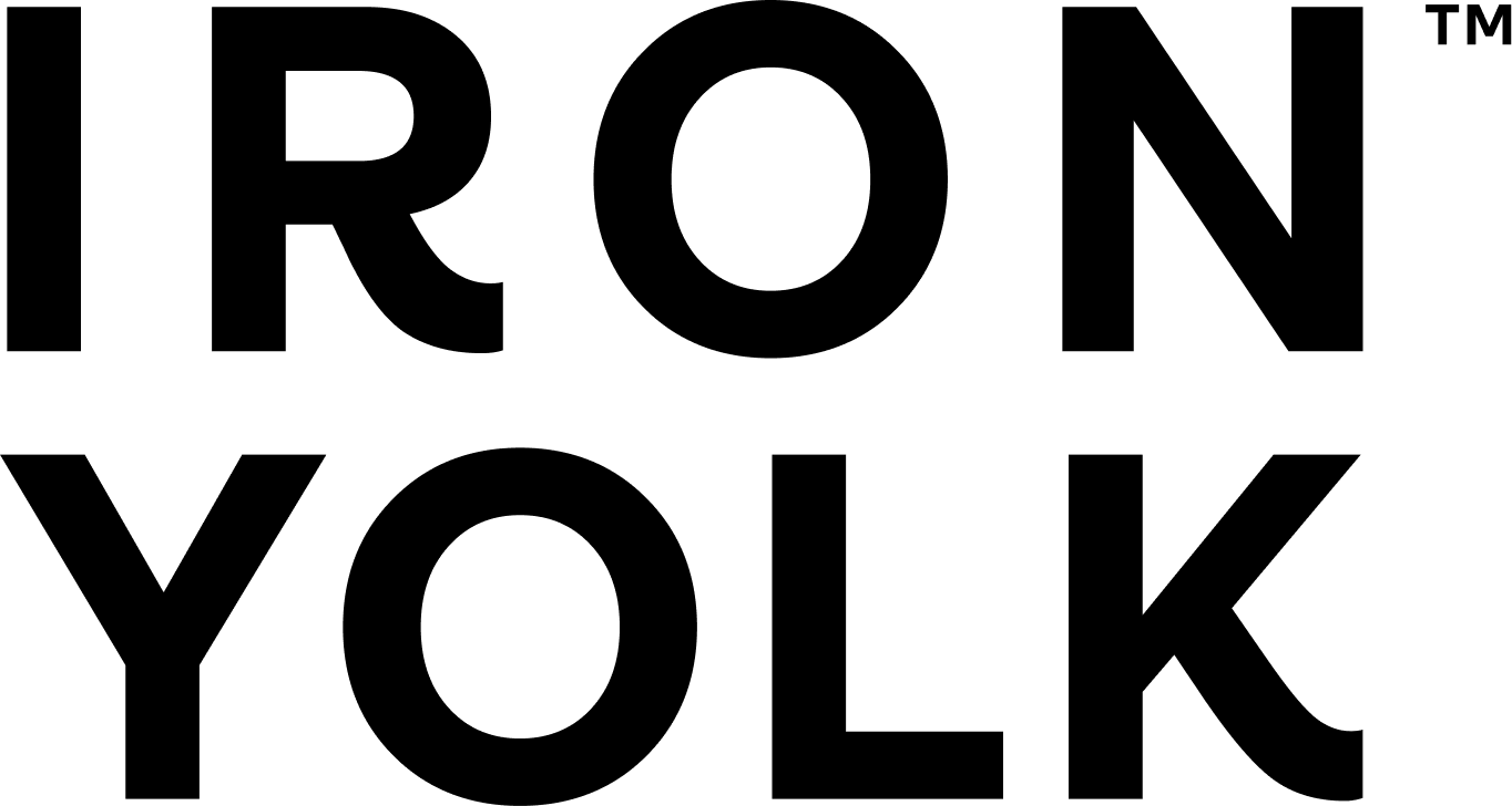 A black-and-white line drawing of a person using a computer with a bird, possibly a crow, sitting on their head.
