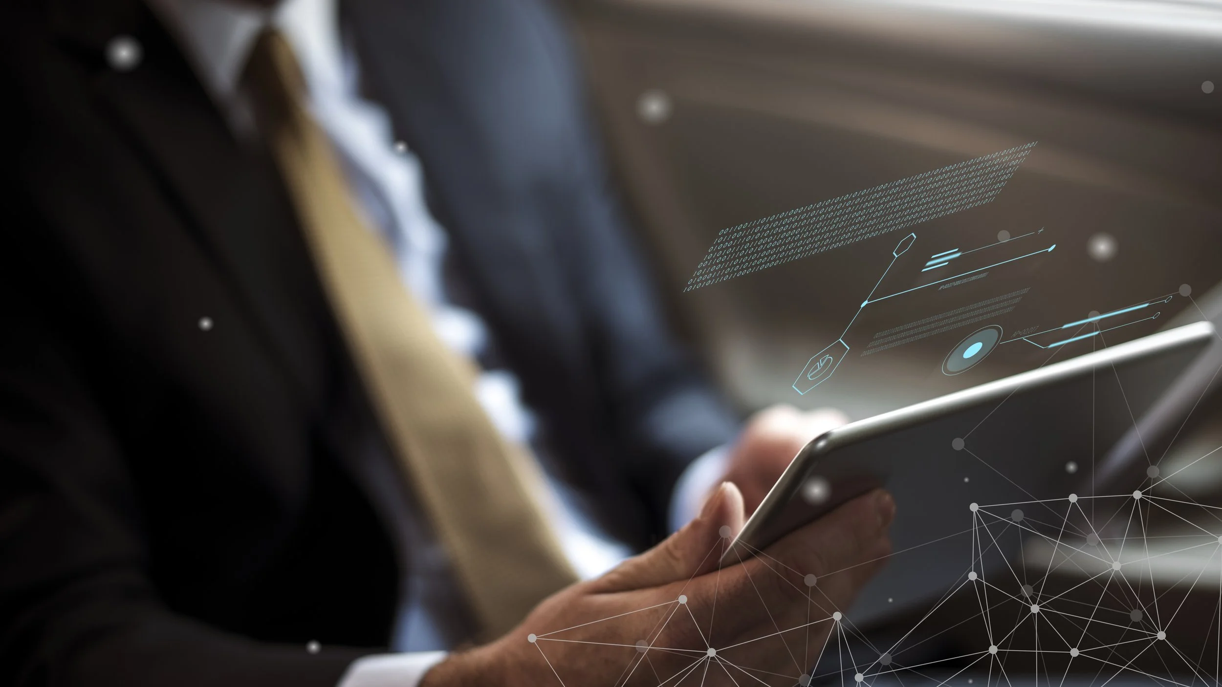 Person in business attire holding a smartphone with digital interface graphics overlayed, including data charts and binary code.