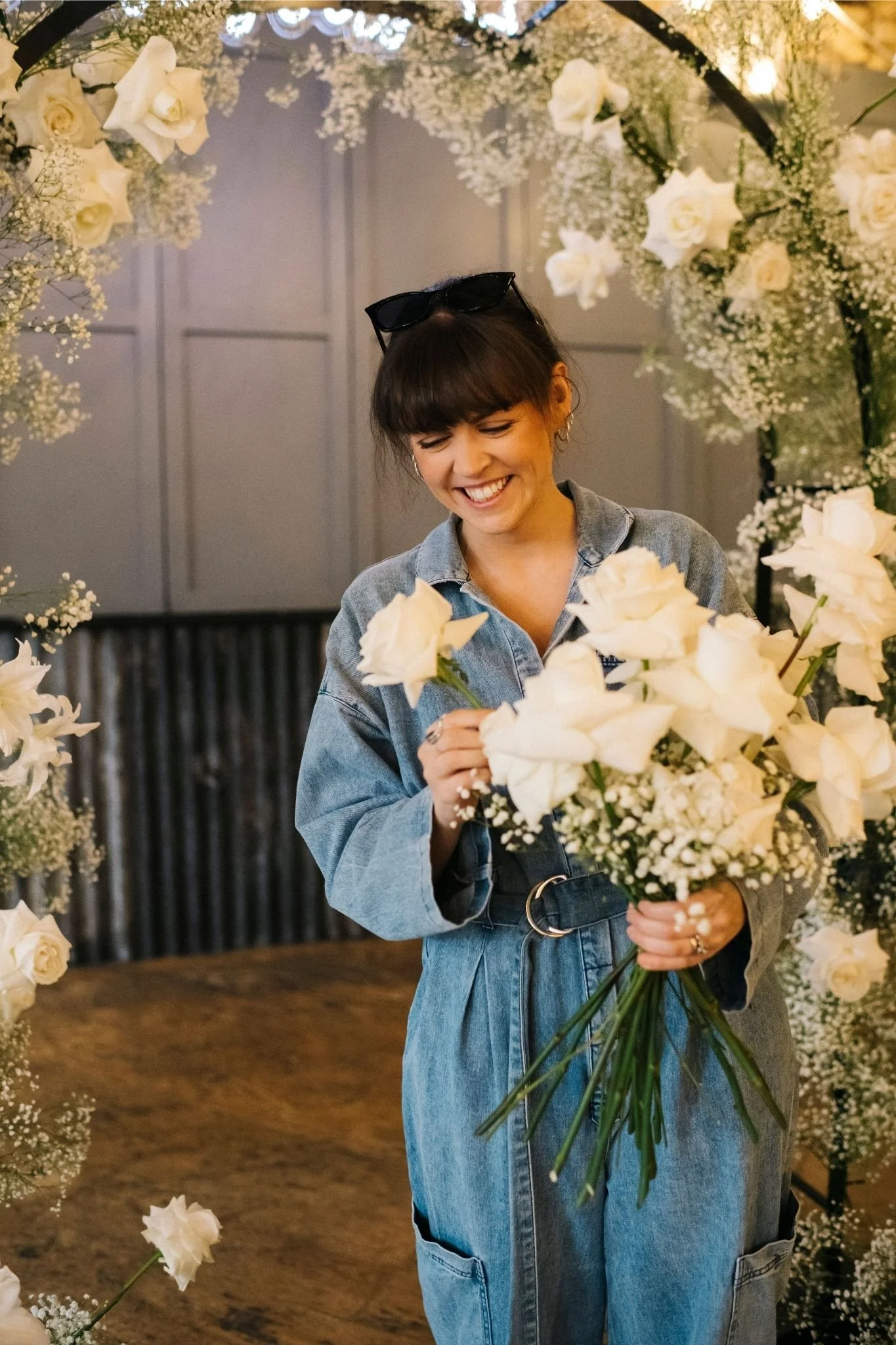 white rose and gypsophila wedding flowers and wedding arch