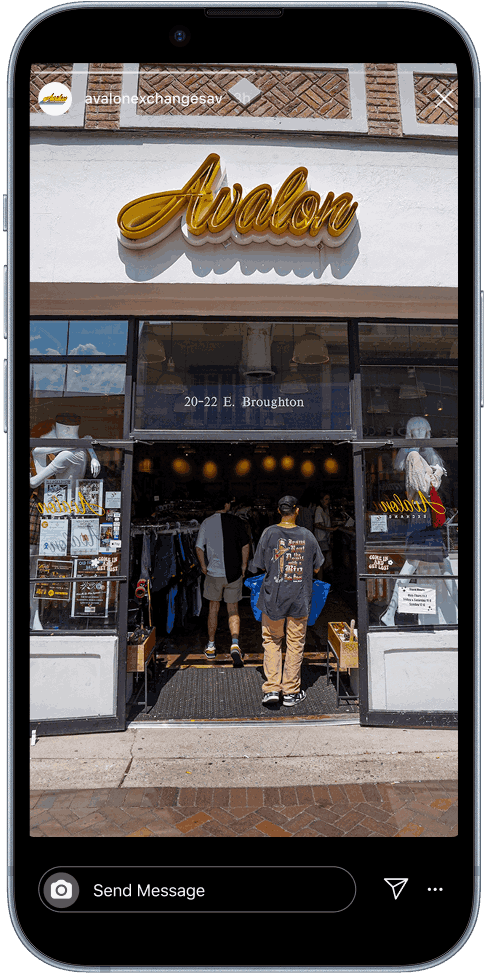 Exterior view of Avalon store with yellow cursive sign above entrance, displaying location 20-22 E. Broughton, with people entering and mannequins inside.