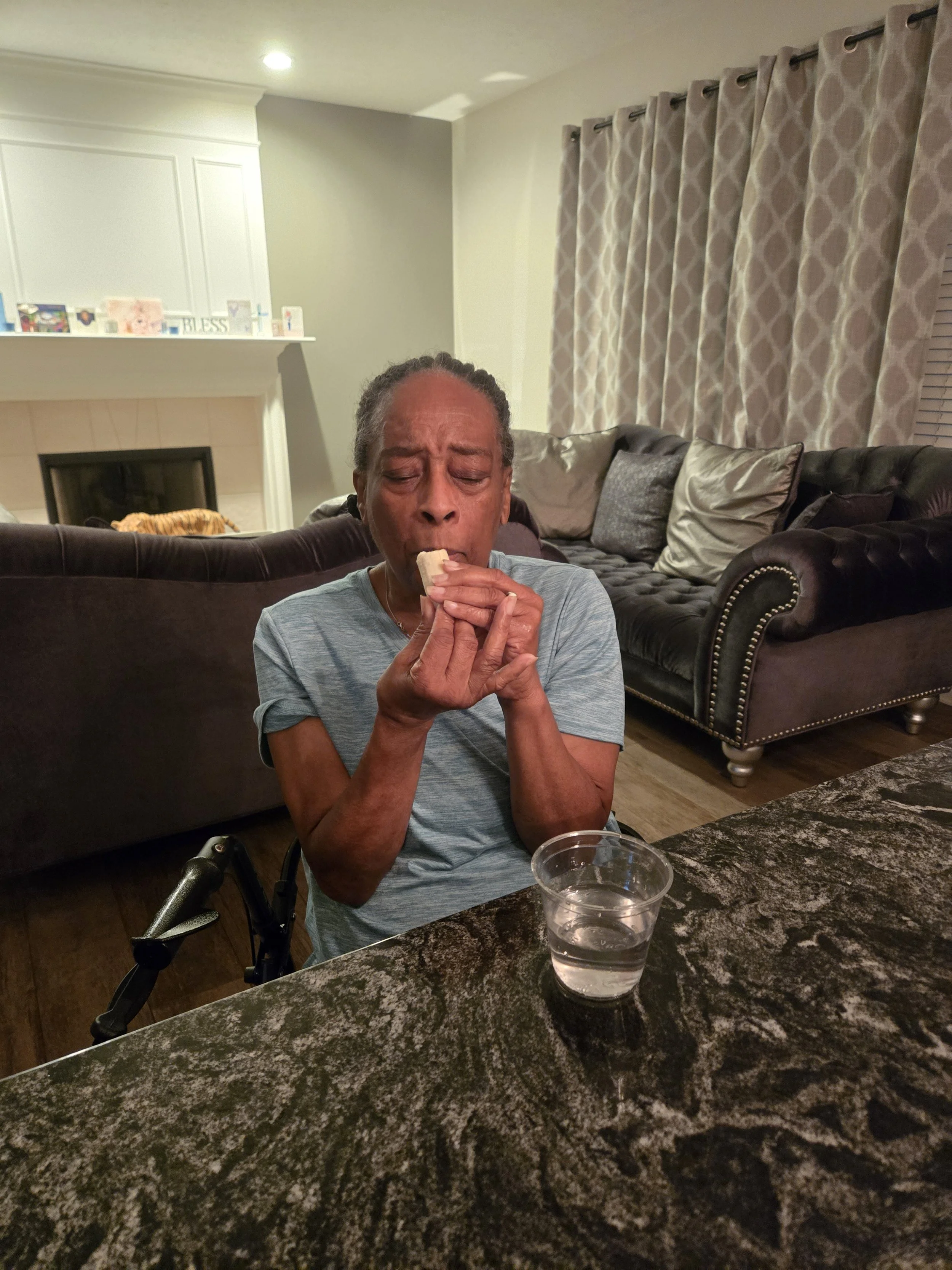 An adult with physical mobility challenges taking proper care of in Denise adult family care - Indianapolis.