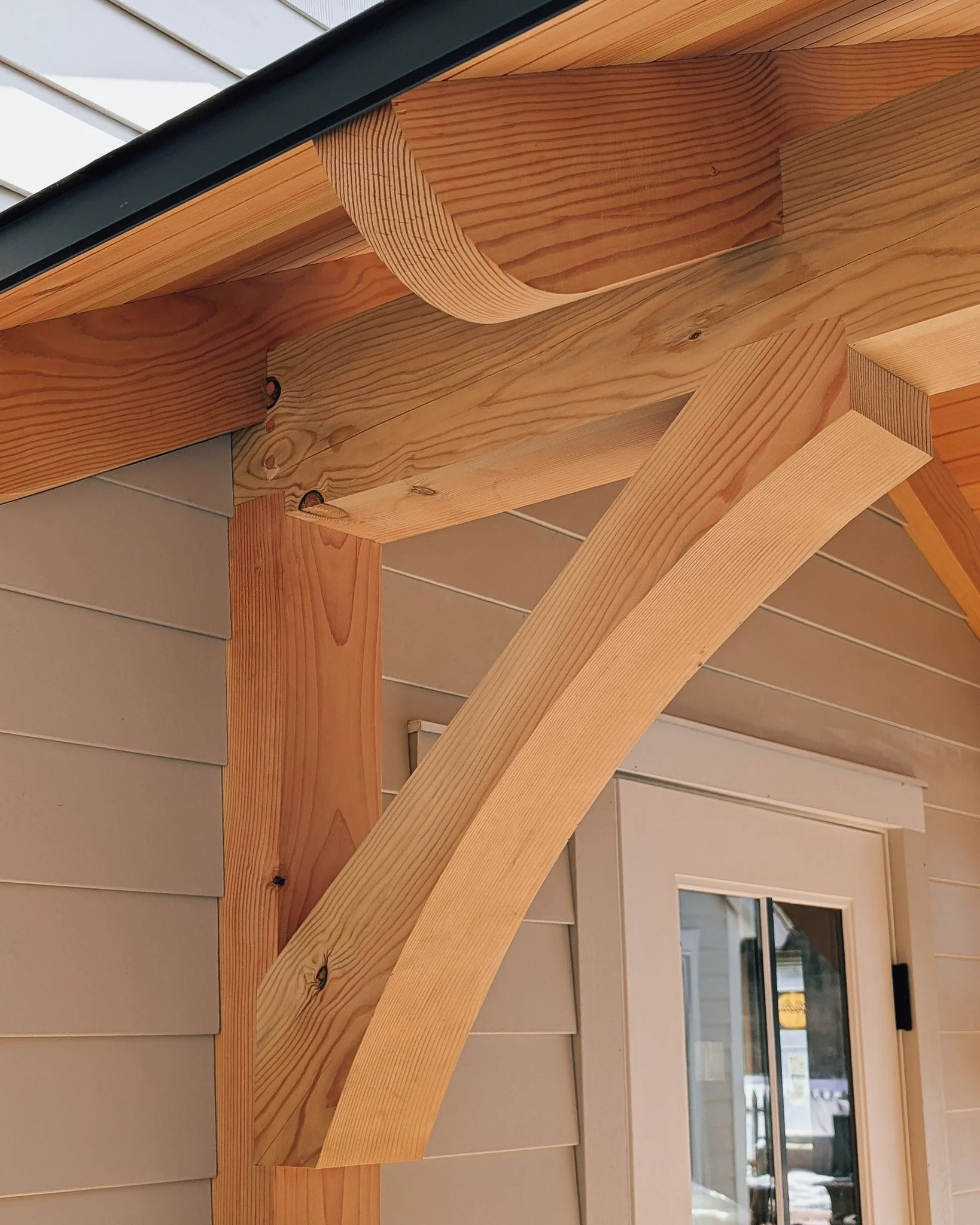 Timber frame walkthrough detail built by Xanadu Build