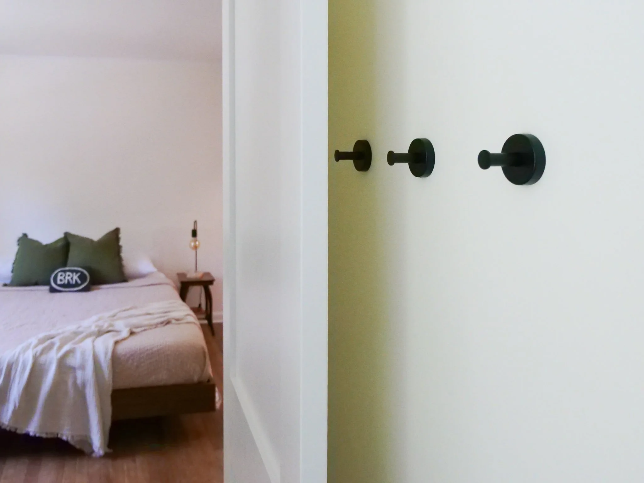 open door looking into a bedroom bed