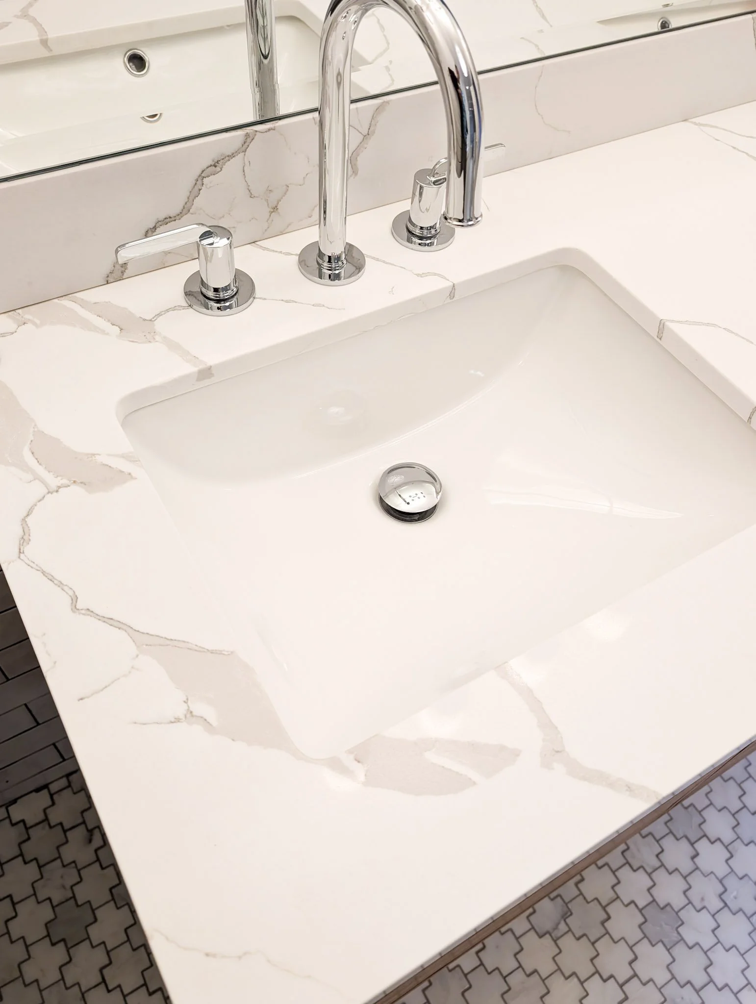White marble vanity top with bold gray veining