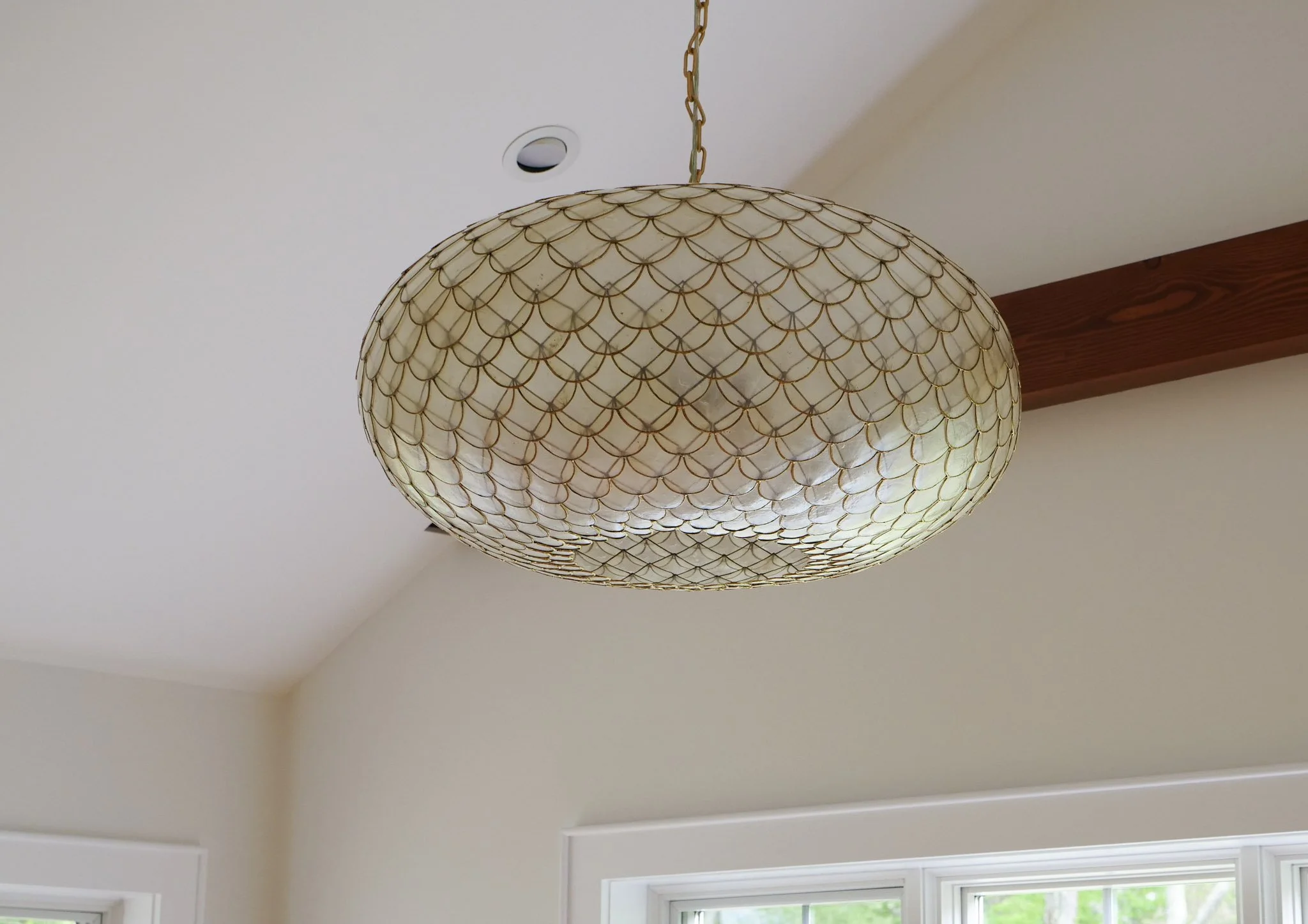 close-up of a scalloped shell chandelier with gold edges