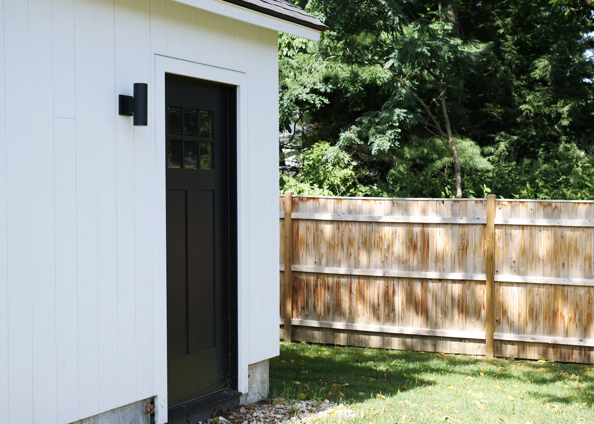 back side door of a white garage