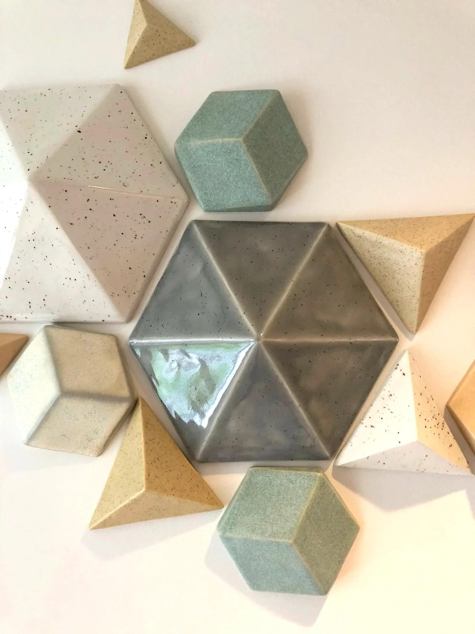 geometric ceramic shapes for bespoke wall installation by CWCCeramics