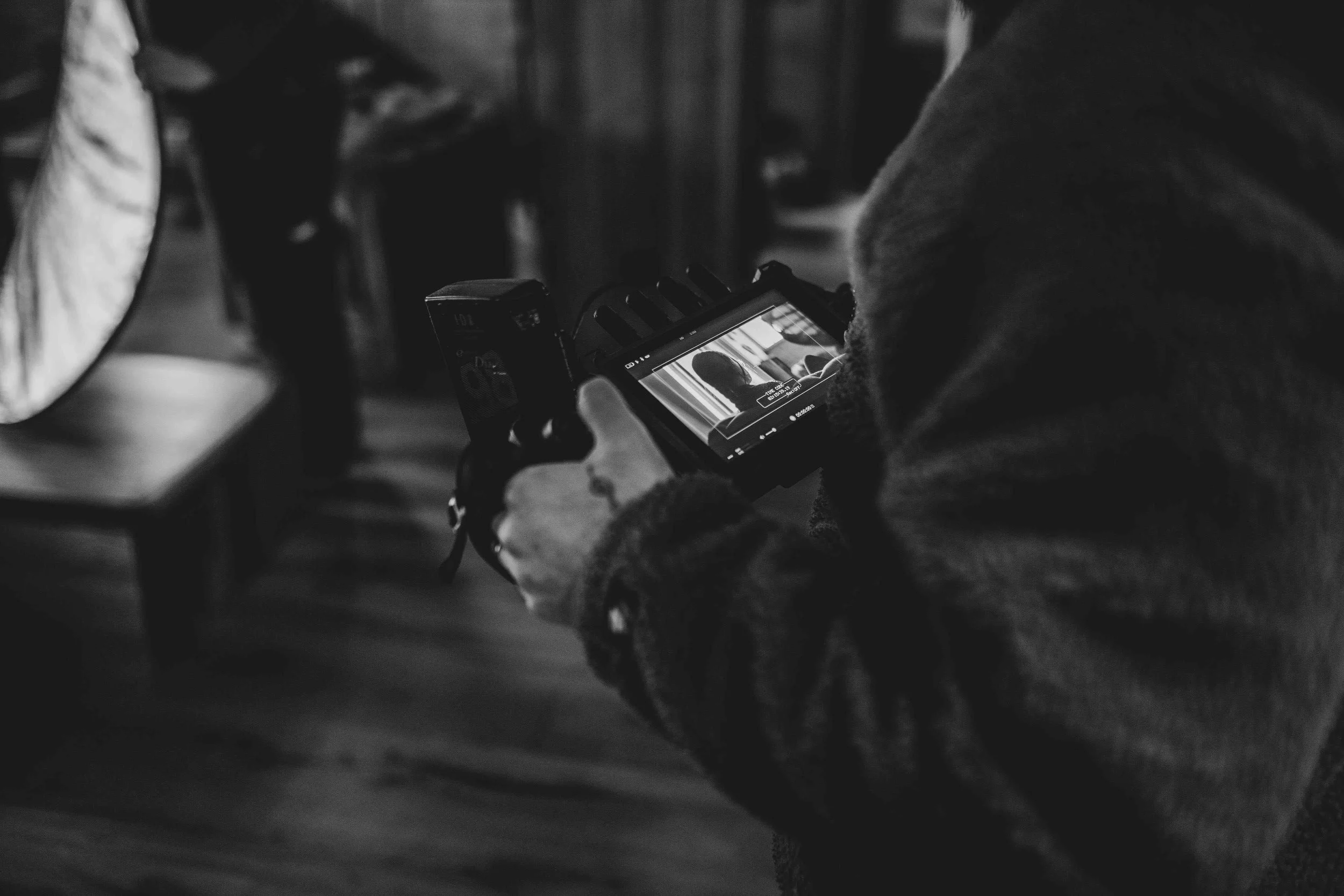 Directors monitor on set with director watching the action unfold
