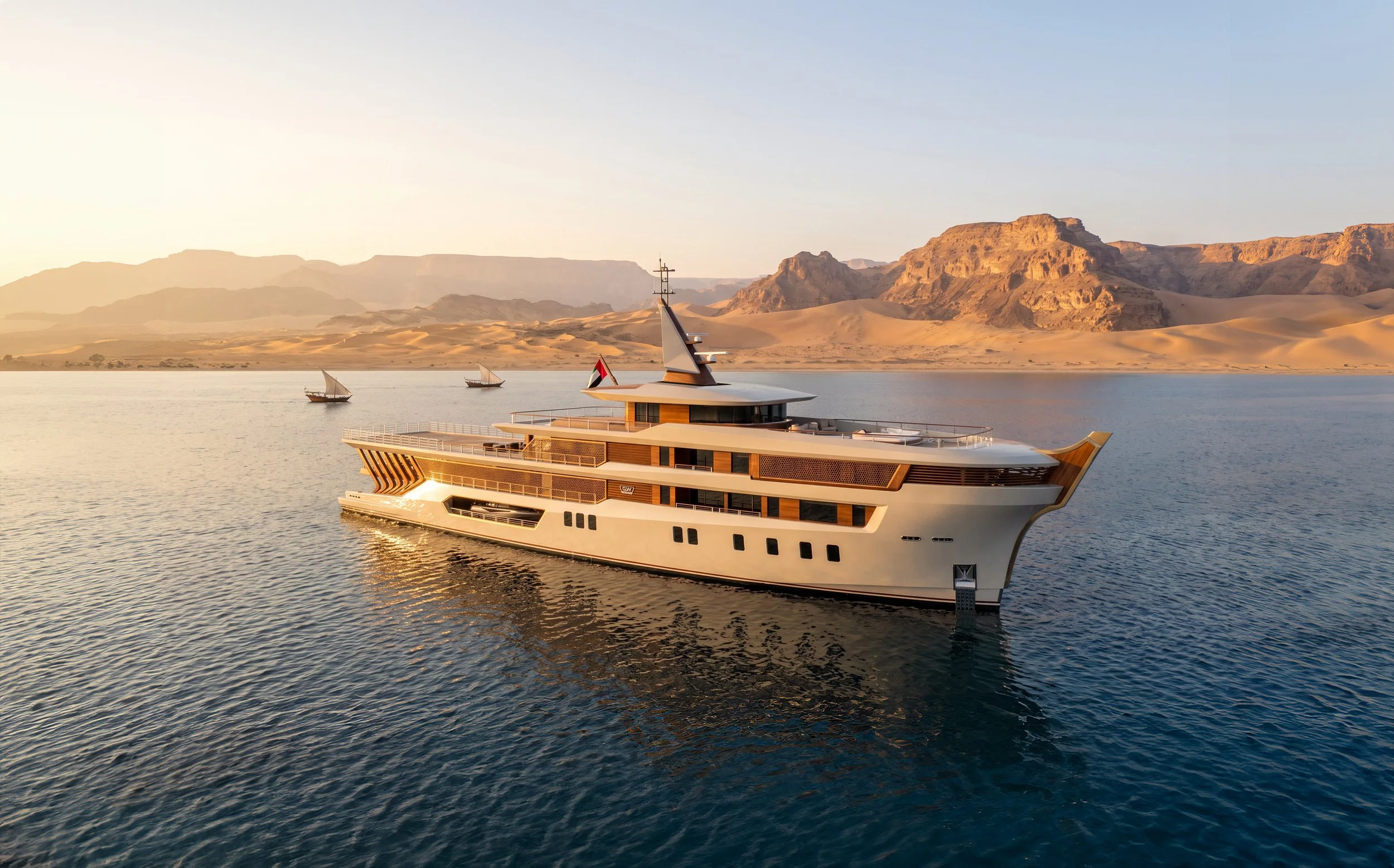 A luxurious yacht sailing on calm water with desert mountains in the background during sunset.