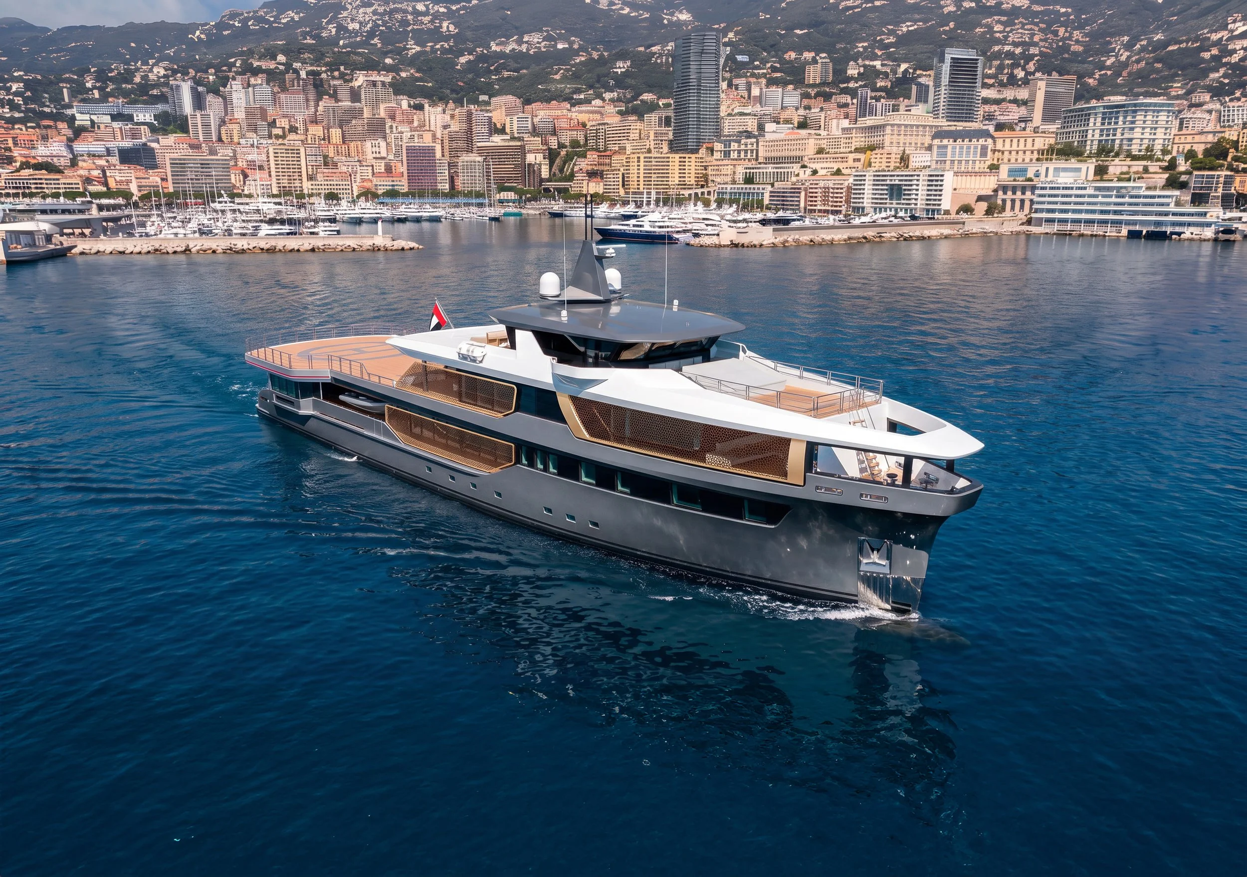 A luxury yacht sailing in a harbor with a city skyline featuring many high-rise buildings and lush green hills in the background.