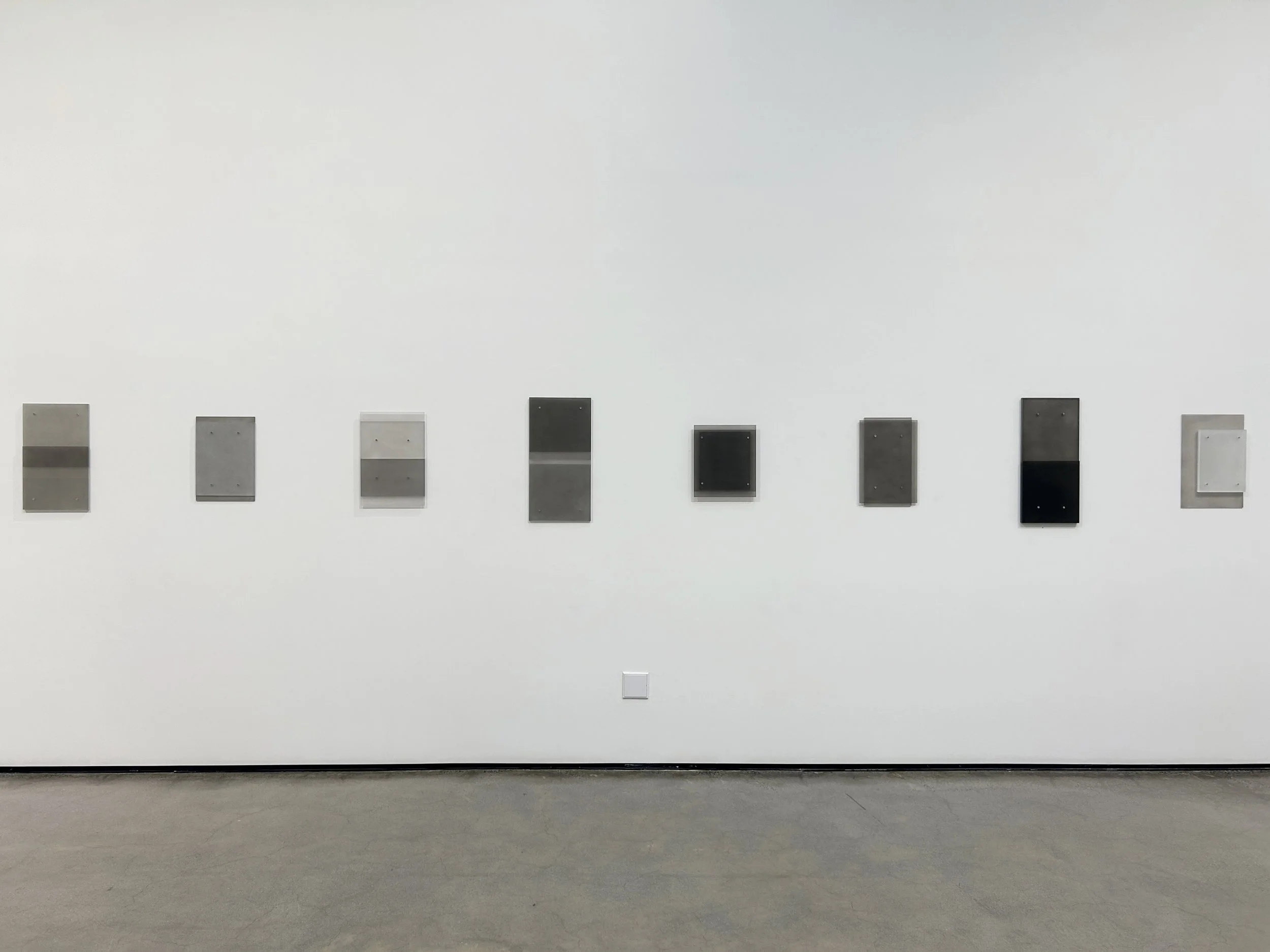 Exhibition shot of 8 small wall reliefs, 2025
