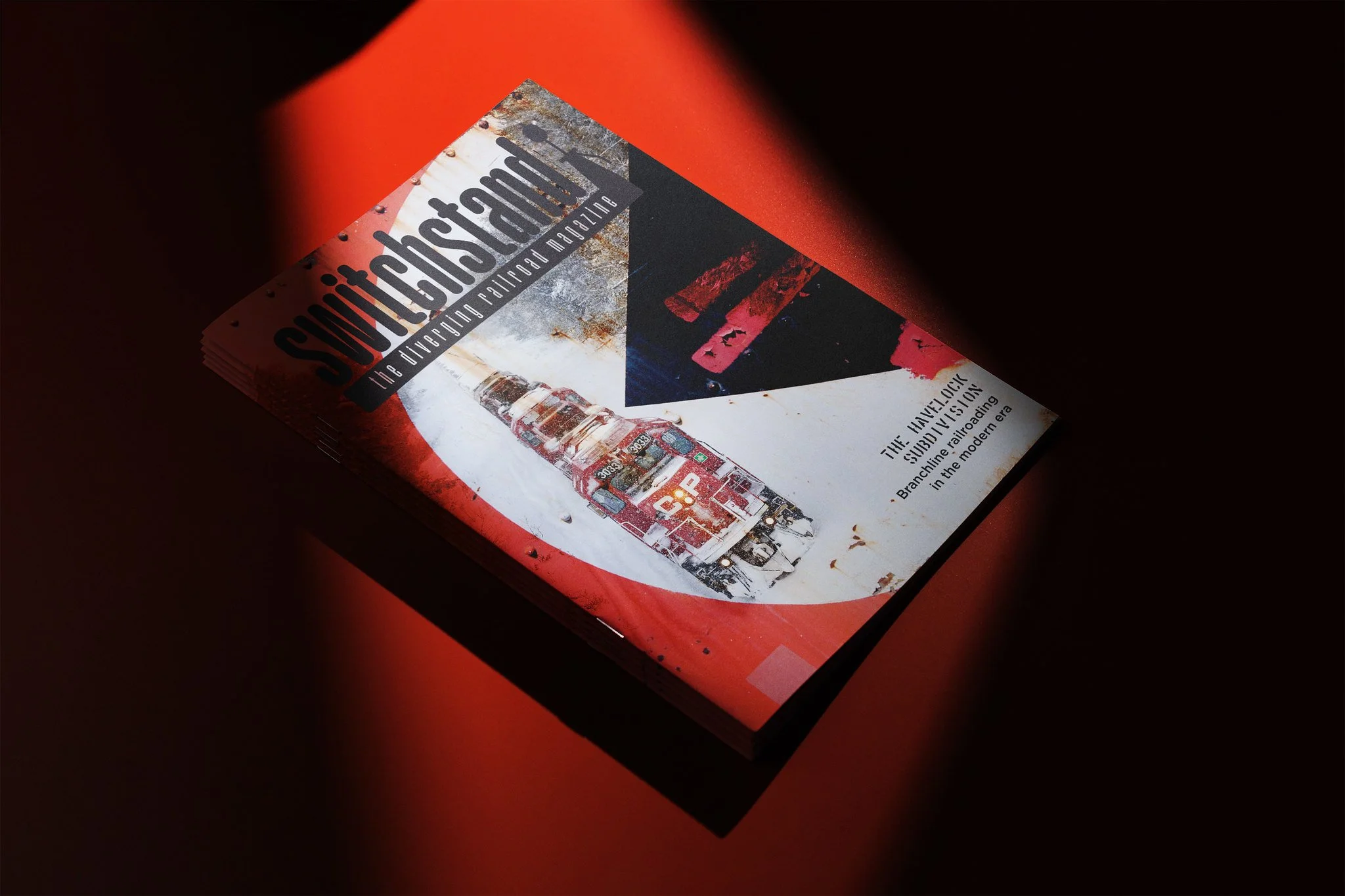 Cover of Swerve magazine titled 'The Average Airroad Magazine,' featuring an image of a red train on snow with a rusty background, with text about the history of the SunRail train in modern era.