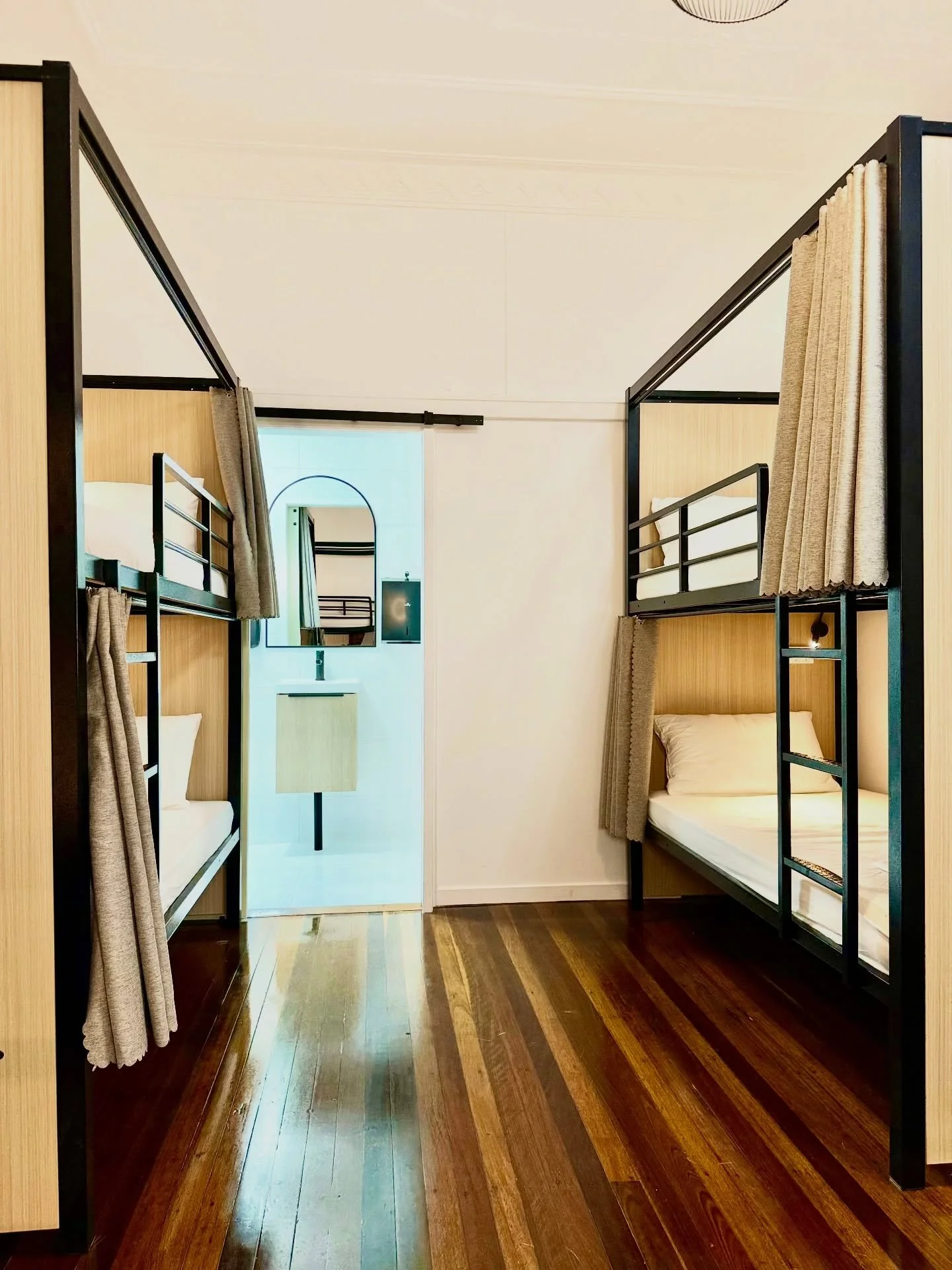 six beds. privacy curtains on every one. your own power point, your own locker, your own little corner of the world.
shared space, private enough to feel like yours.
#stayherveys #herveybay #backpackerslife #dormlife #hostelvibe