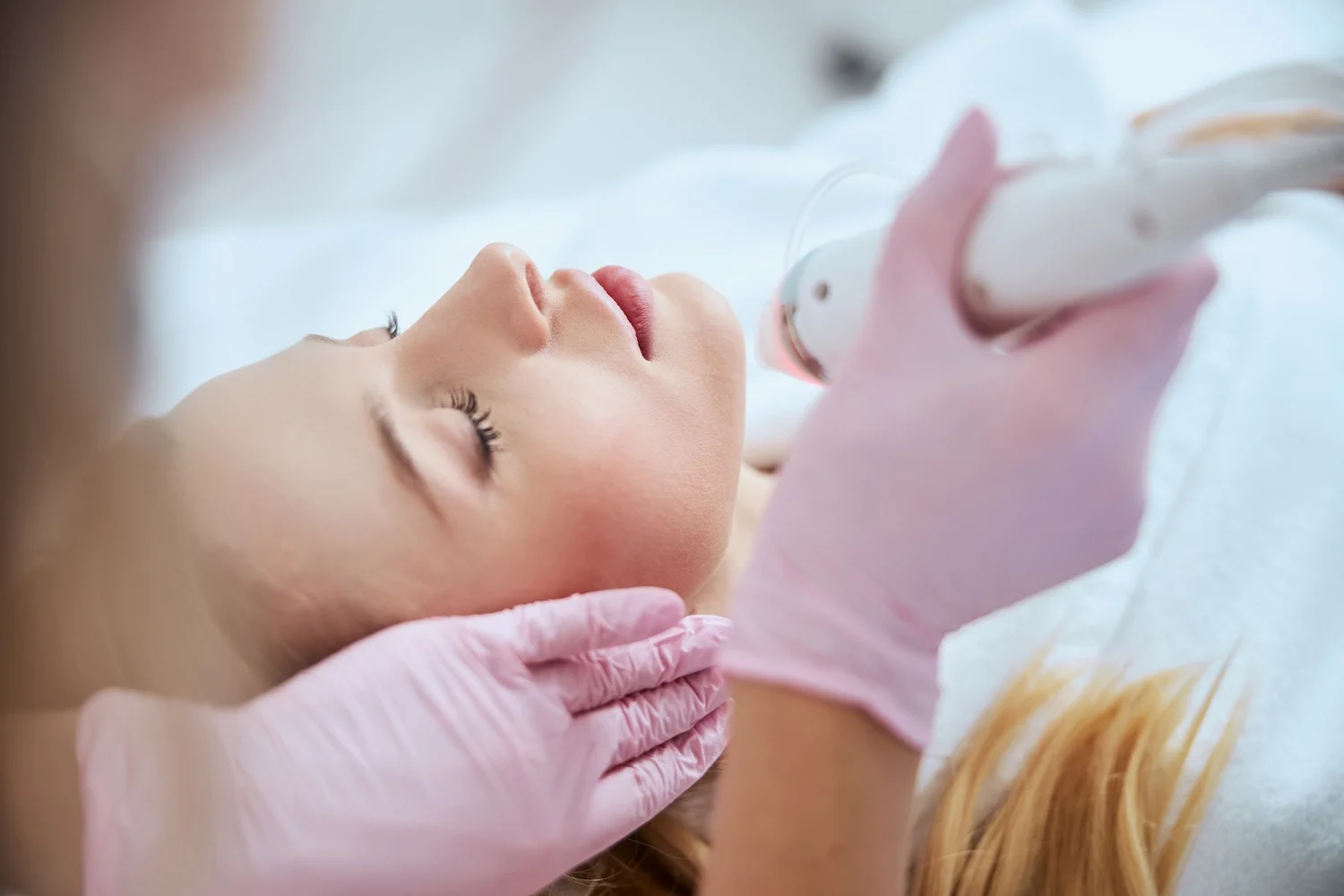 Client receiving professional microneedling facial treatment for smoother, rejuvenated skin