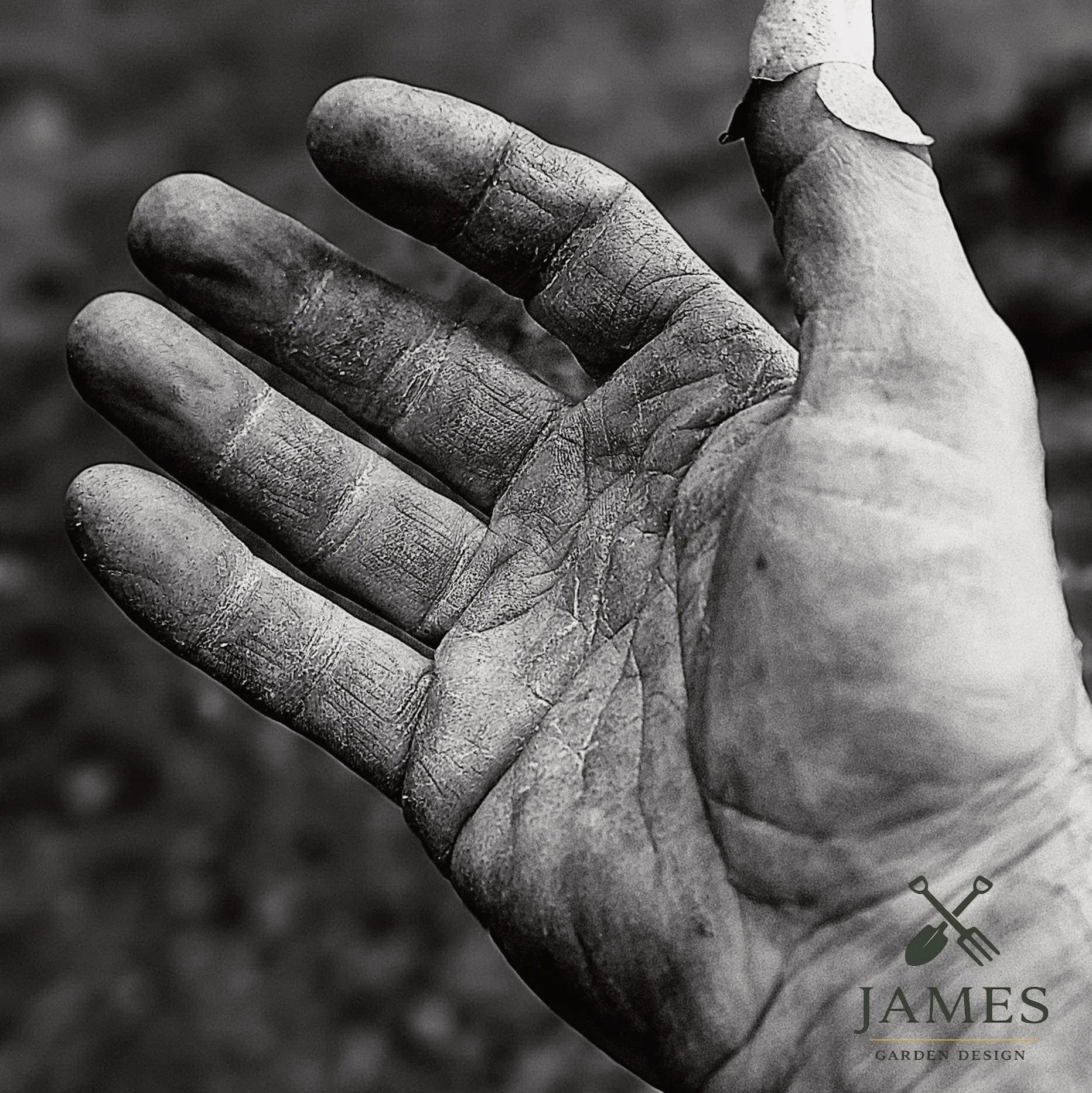 Close-up of a hand with weathered, textured skin, slightly dirty fingers, and nails. The background is blurred. The bottom right corner features a logo with gardening tools and the text 'JAMES GARDEN DESIGN'.