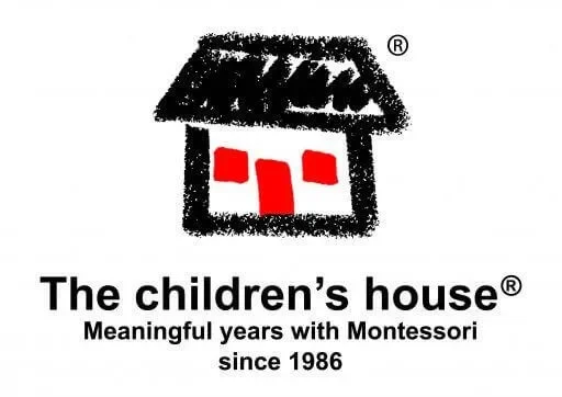 Logo for The Children's House, featuring a stylized black and white house with red square windows and a red door, along with text stating "The children's house" and "Meaningful years with Montessori since 1986."