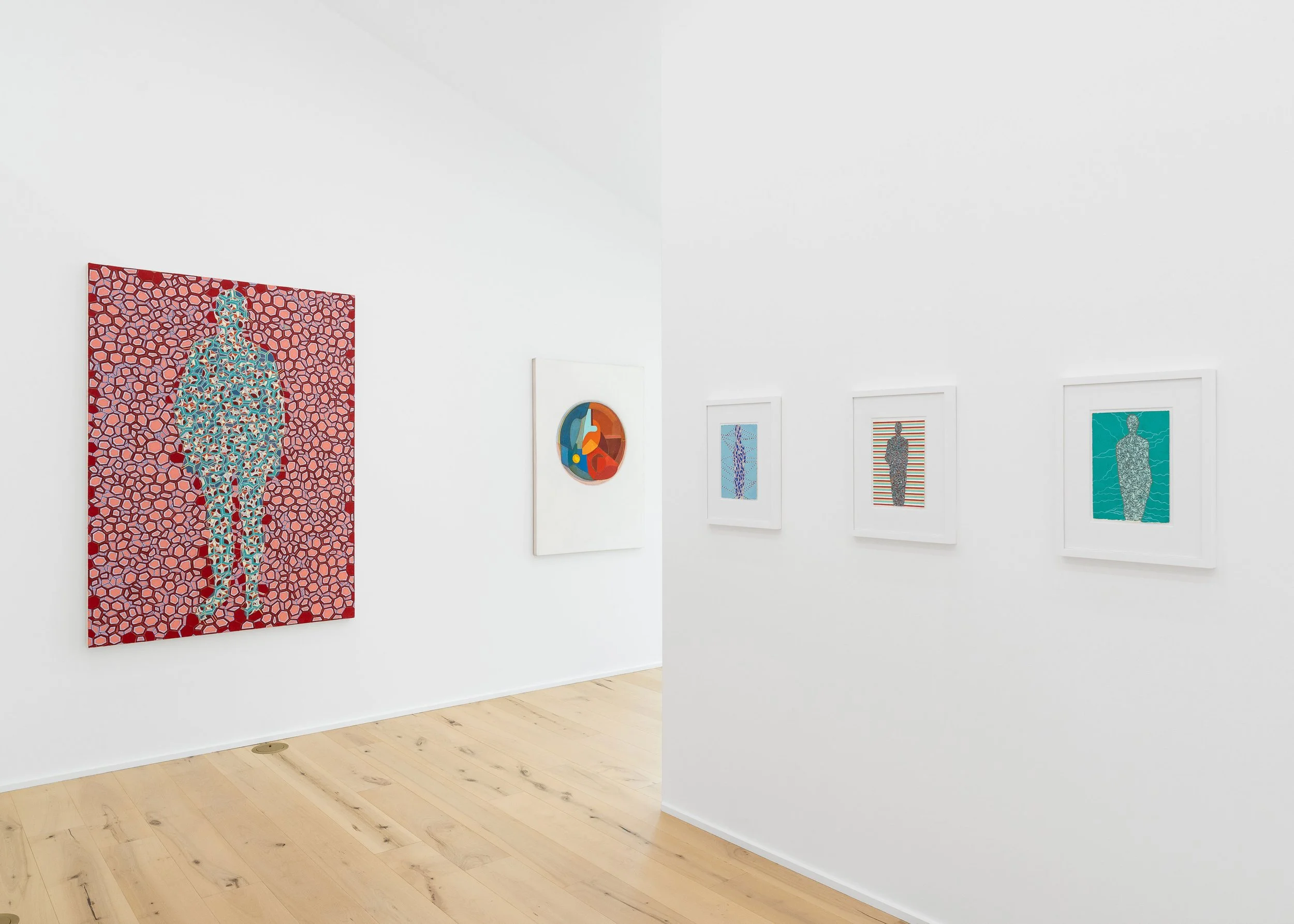 Art gallery with colorful modern artworks on white walls, including a large portrait of a figure with a patterned background and smaller abstract pieces.