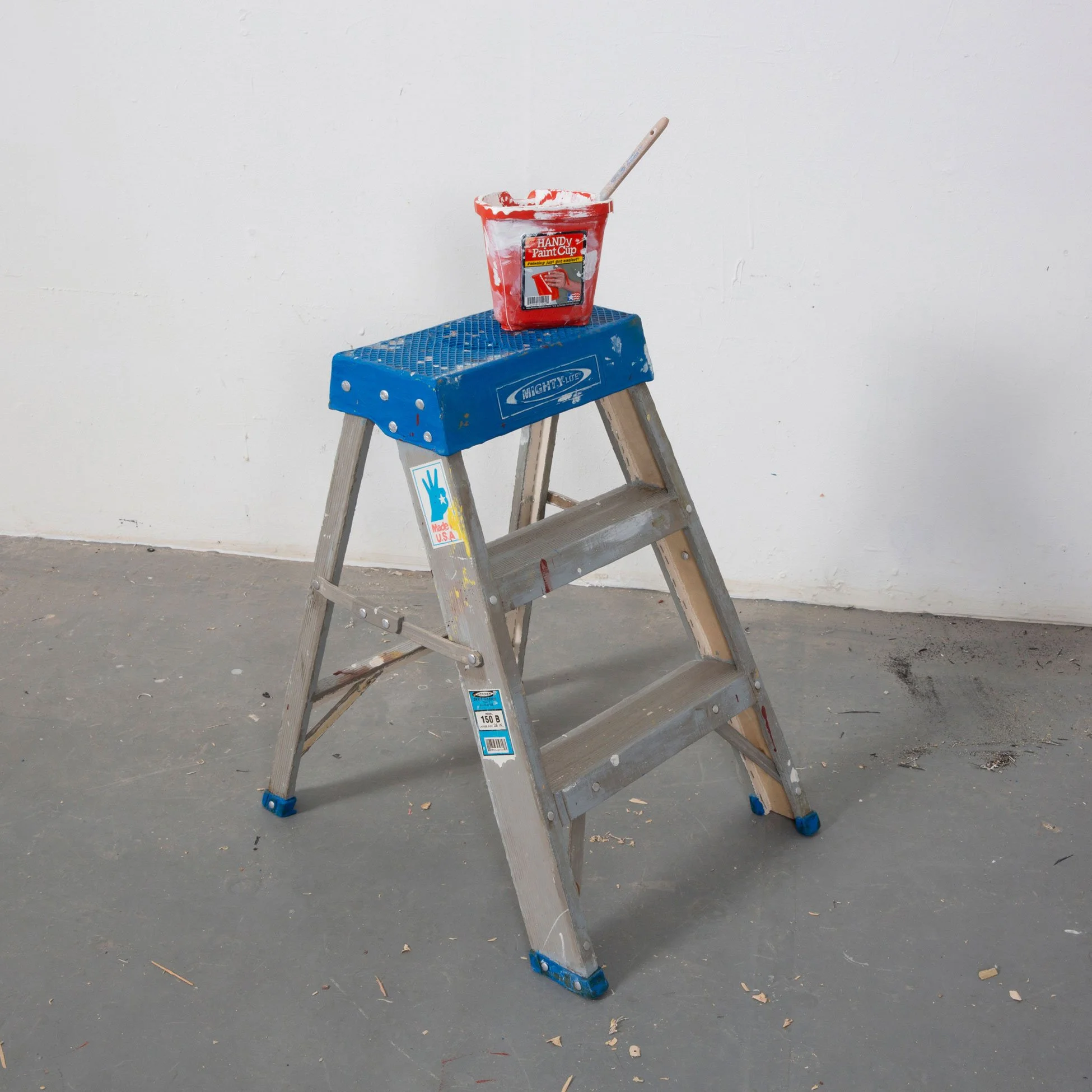 Justin Richel 
 Small Step (Mighty-lite) + Handy Paint Pot
(Painting Just Got Easier) + Paint Stick
(thinking of painting?)  
Acrylic, casein, gouache on shaped canvas
and linen + Acrylic, gouache, paper on
shaped canvas + carved wood 
2022