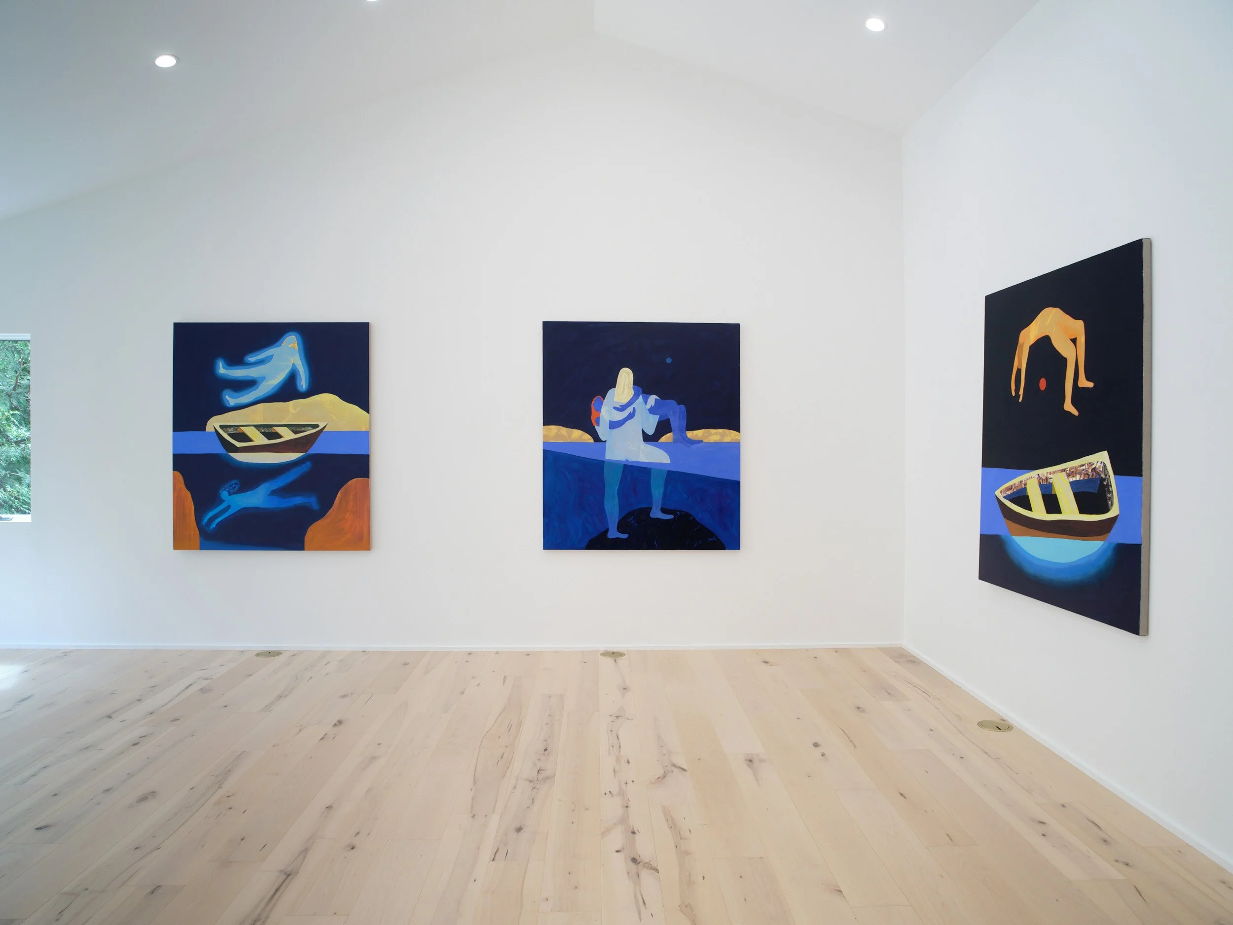 Art gallery with three paintings displayed on white walls, showing abstract figures and boats with blue and yellow tones.