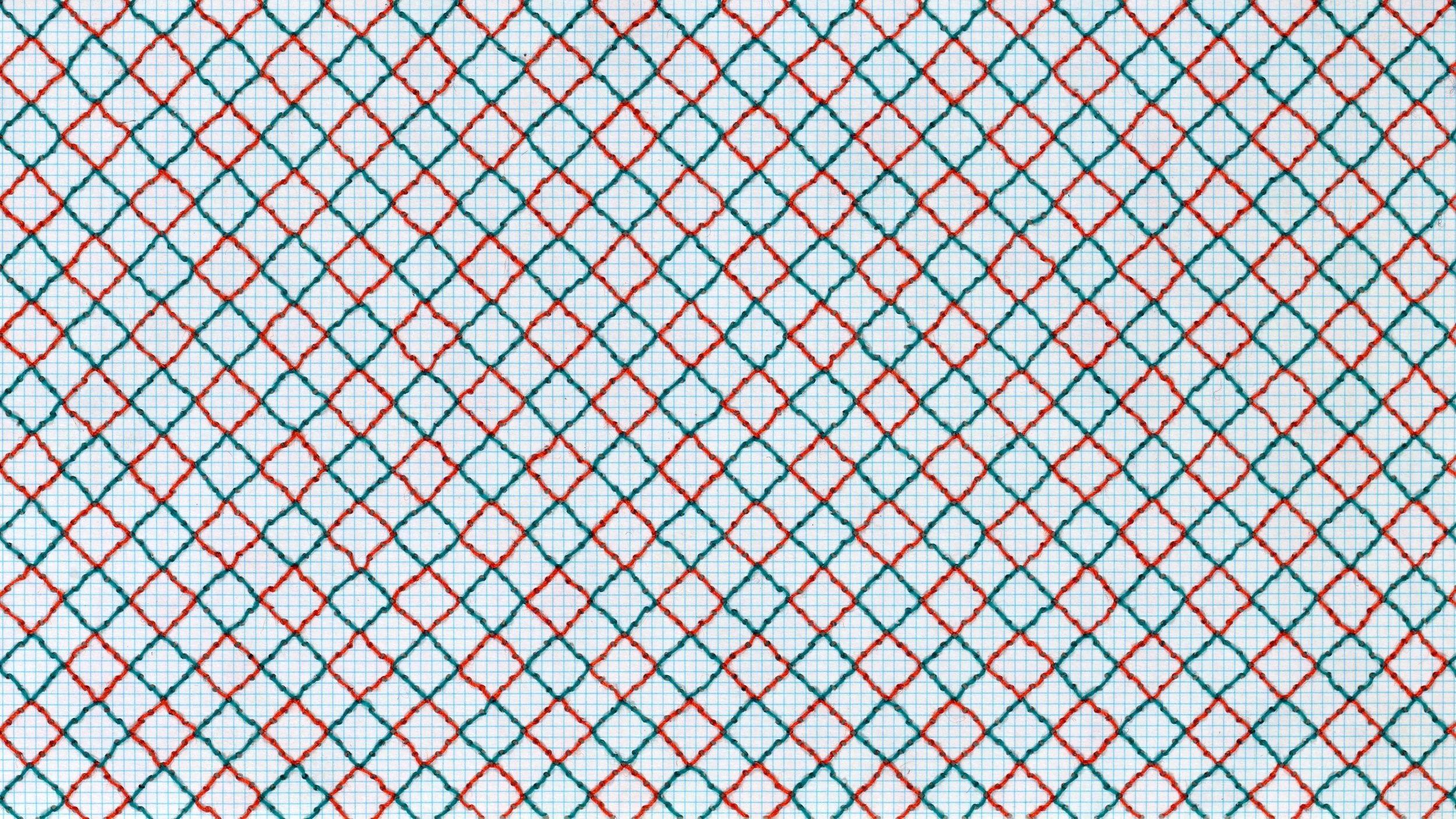 A piece of graph paper with a pattern of diamond shapes stitched in red and blue thread.